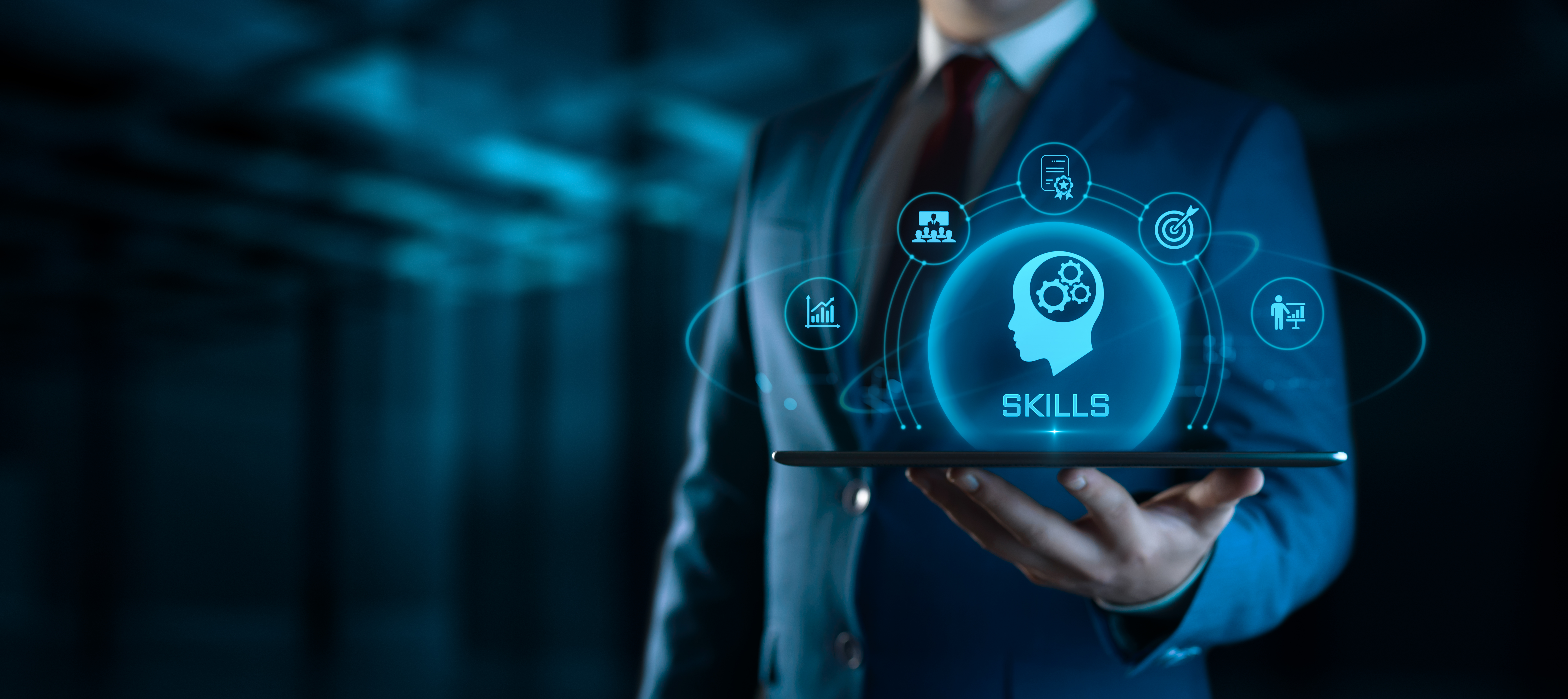 businessman holding tablet with skills icons on sc 5f067a9373cf5c889473