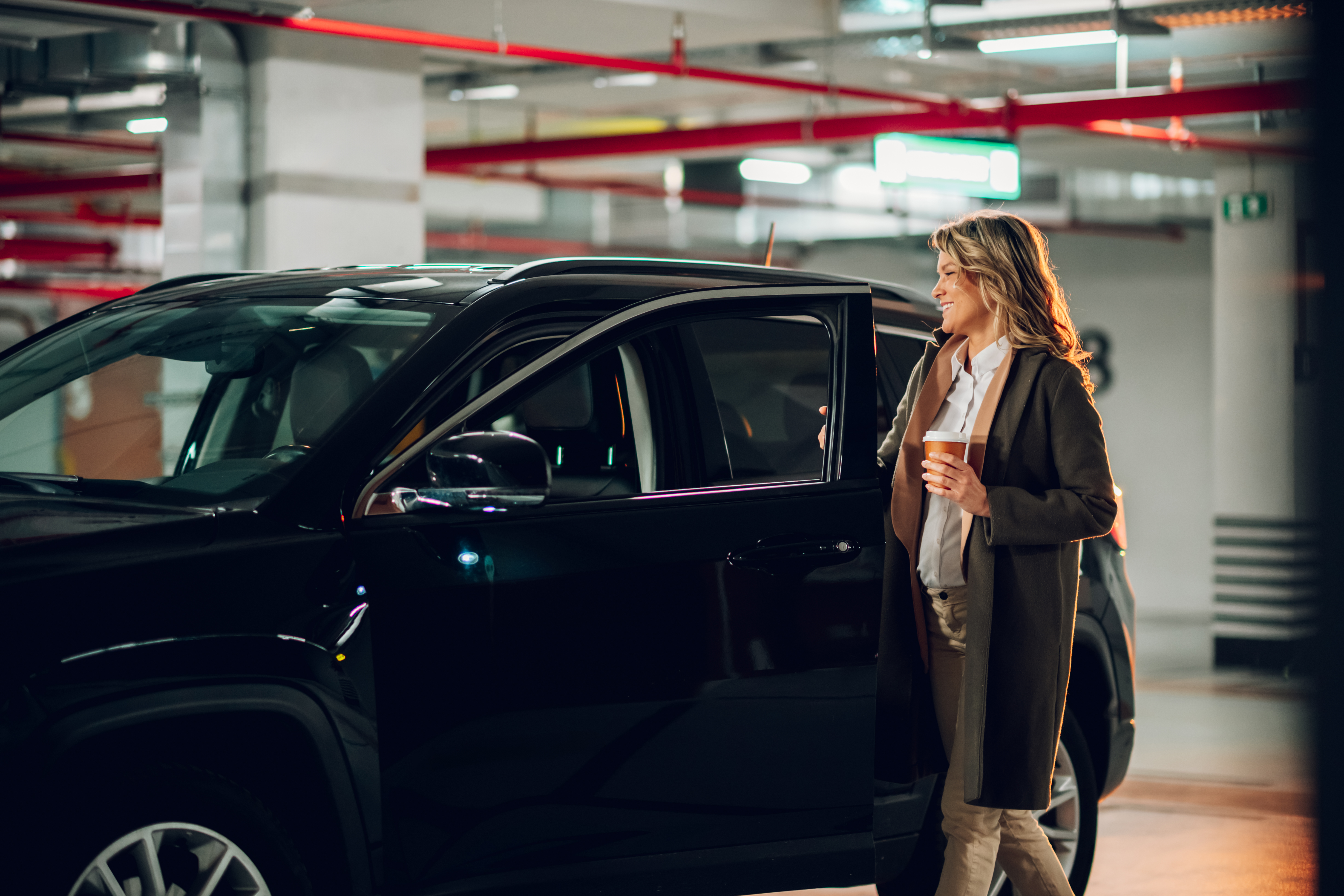 Professional chauffeur providing executive transportation in a luxury vehicle