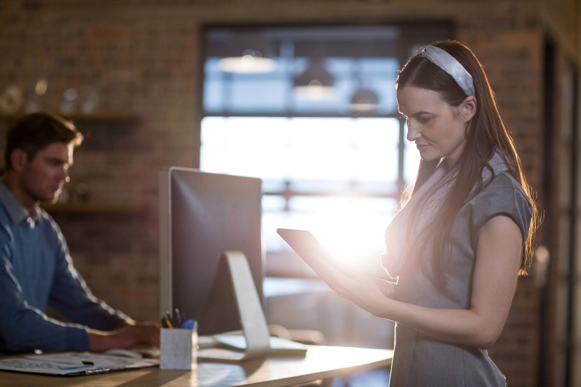 businesswoman using digital tablet in office 36893bc635536913e3bd