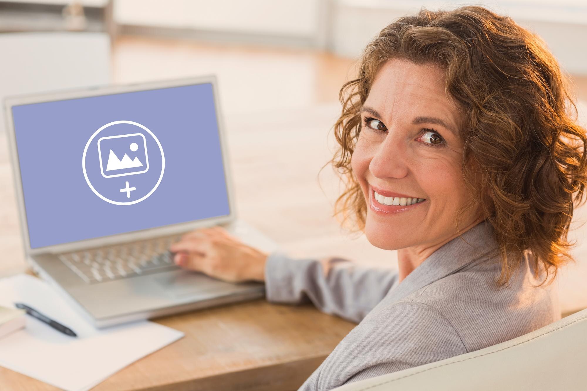 businesswoman using laptop at desk in creative off 2bcf34fff3696c961ae0