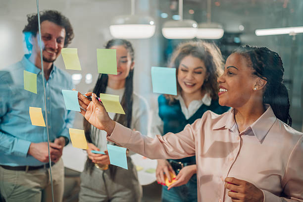 10 simple ways to make your small business website look professional (without breaking the bank) 2 businesswoman writing on sticky notes during a bra 6738c340577a42cfe087