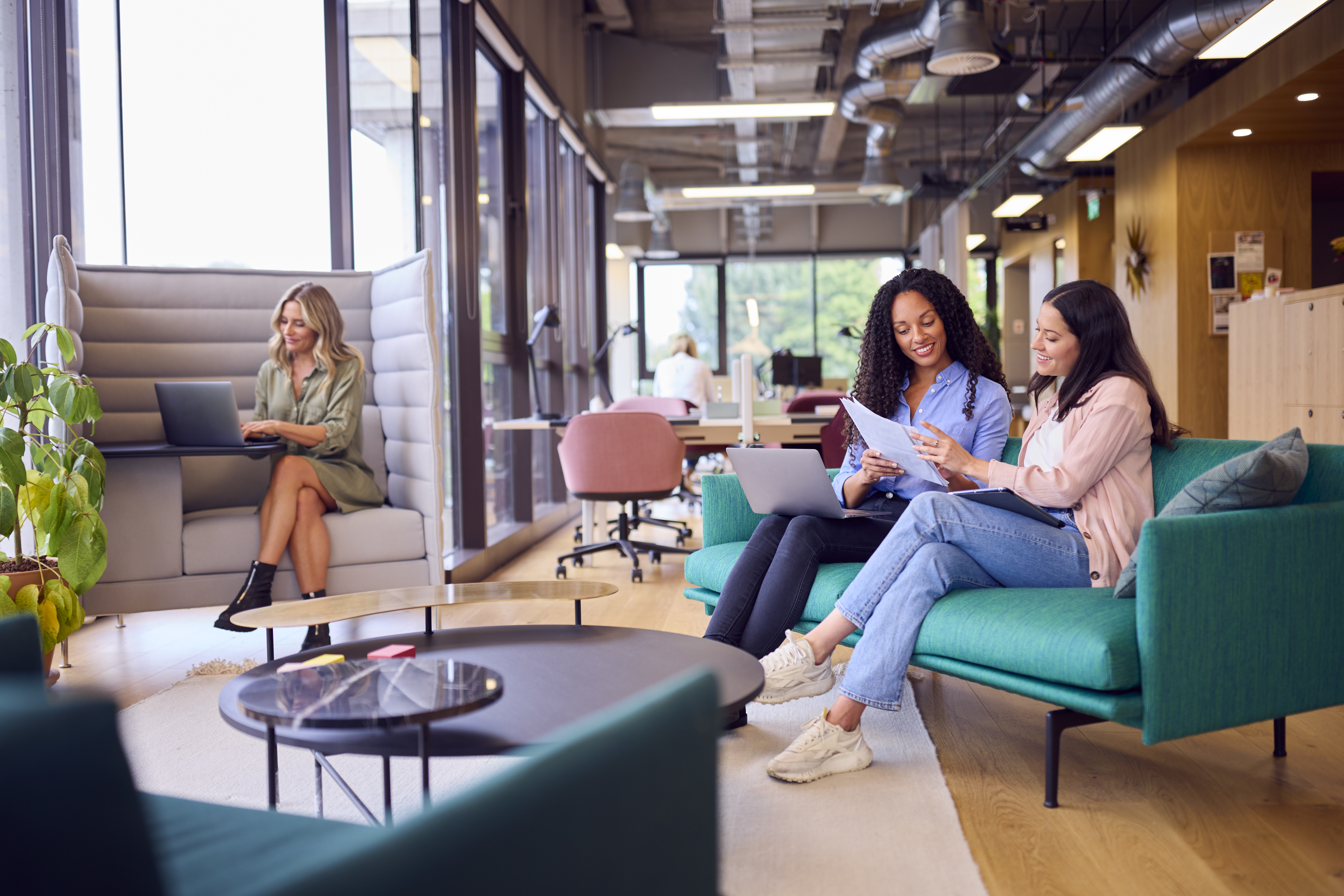 Avoiding the Potholes: Building Your Dream Travel Business 3 businesswomen having informal meeting in breakout d4f94104b462f6f6e354