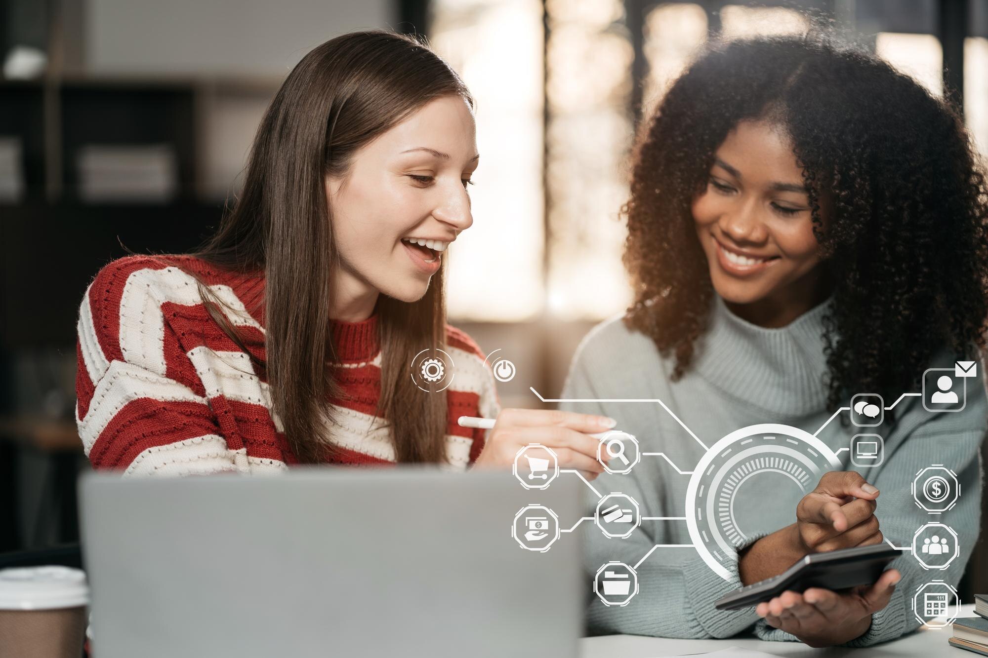 Two businesswomen collaborating with a laptop and tablet, discussing digital tools for online review management and Google Business Profile optimization, with graphical icons representing automation and engagement.