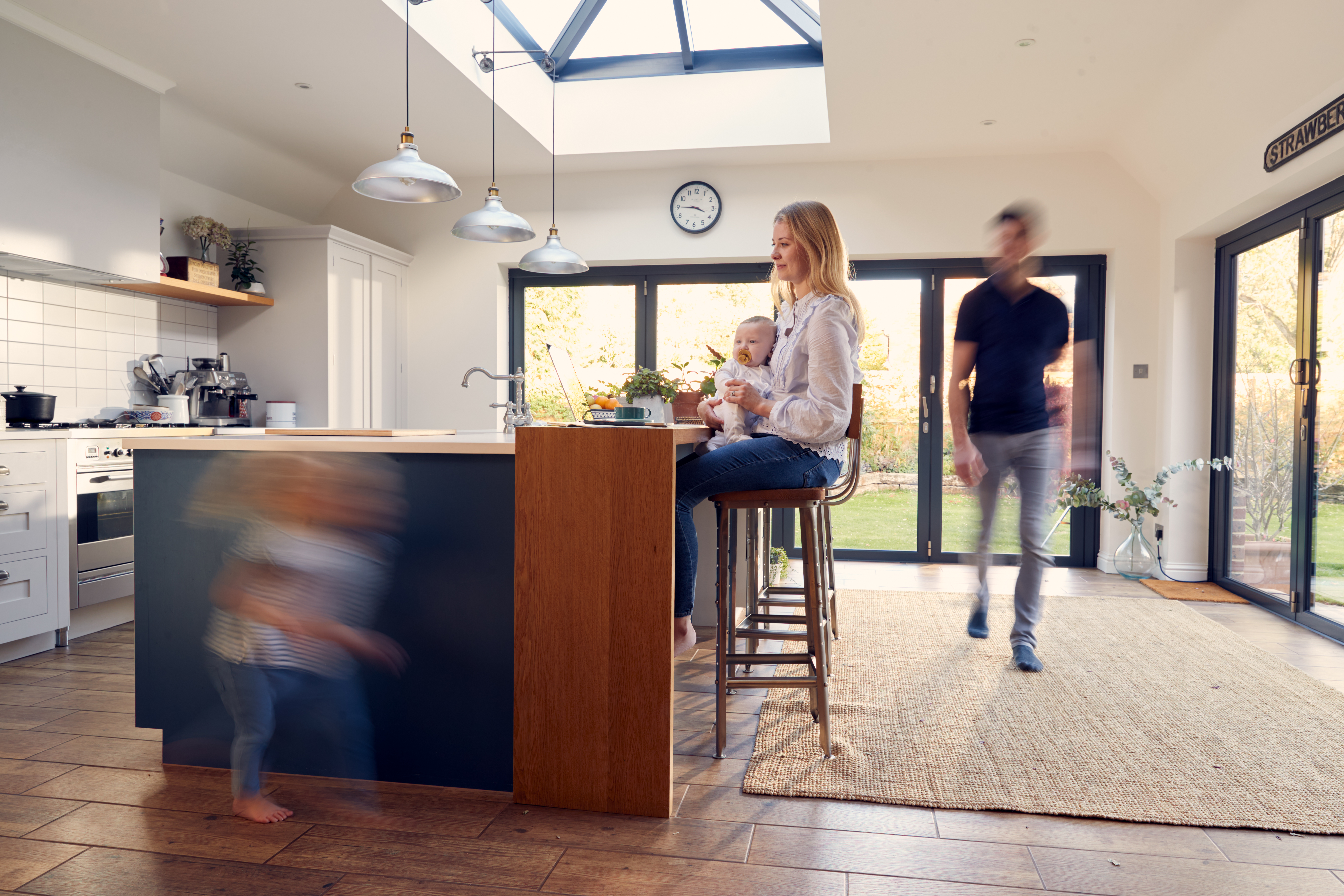 busy family kitchen with mother working on laptop 8abe0a7cd8e4153f9a7d