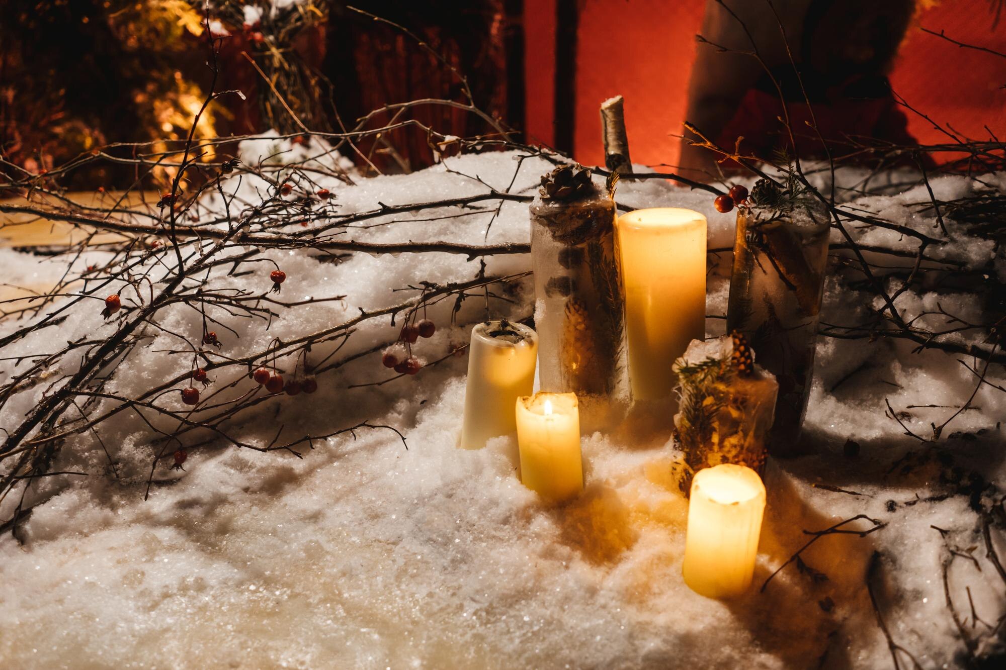candles in the snow branches as decoration f85cfc112f5c8cca8782