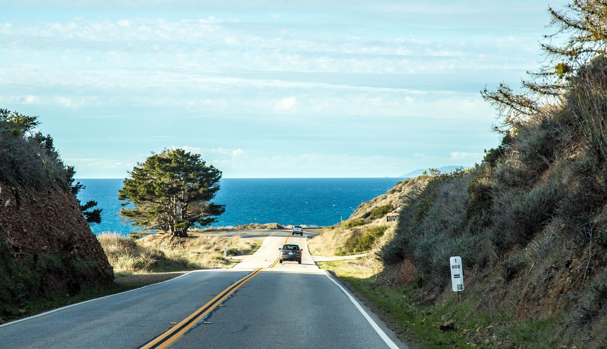 car driving on the highway road to the sea 9b138d0af8d82ed98215 BTOURS