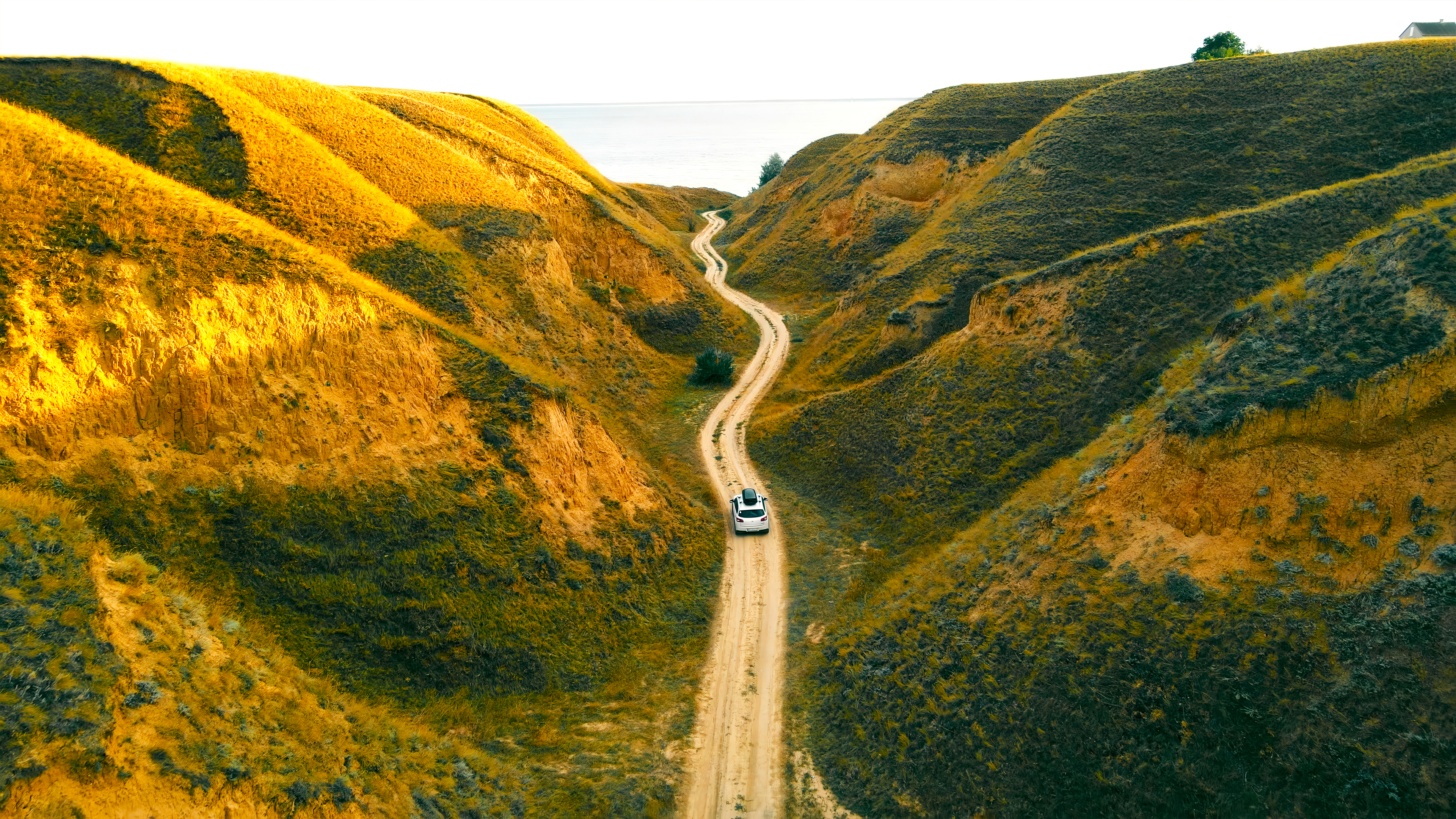 The Perfect Blend: Balancing Plans and Spontaneity on Your Multi-Day Tour 3 car driving through a winding dirt road between go 98c6639ffb510d0bfe86 BTOURS