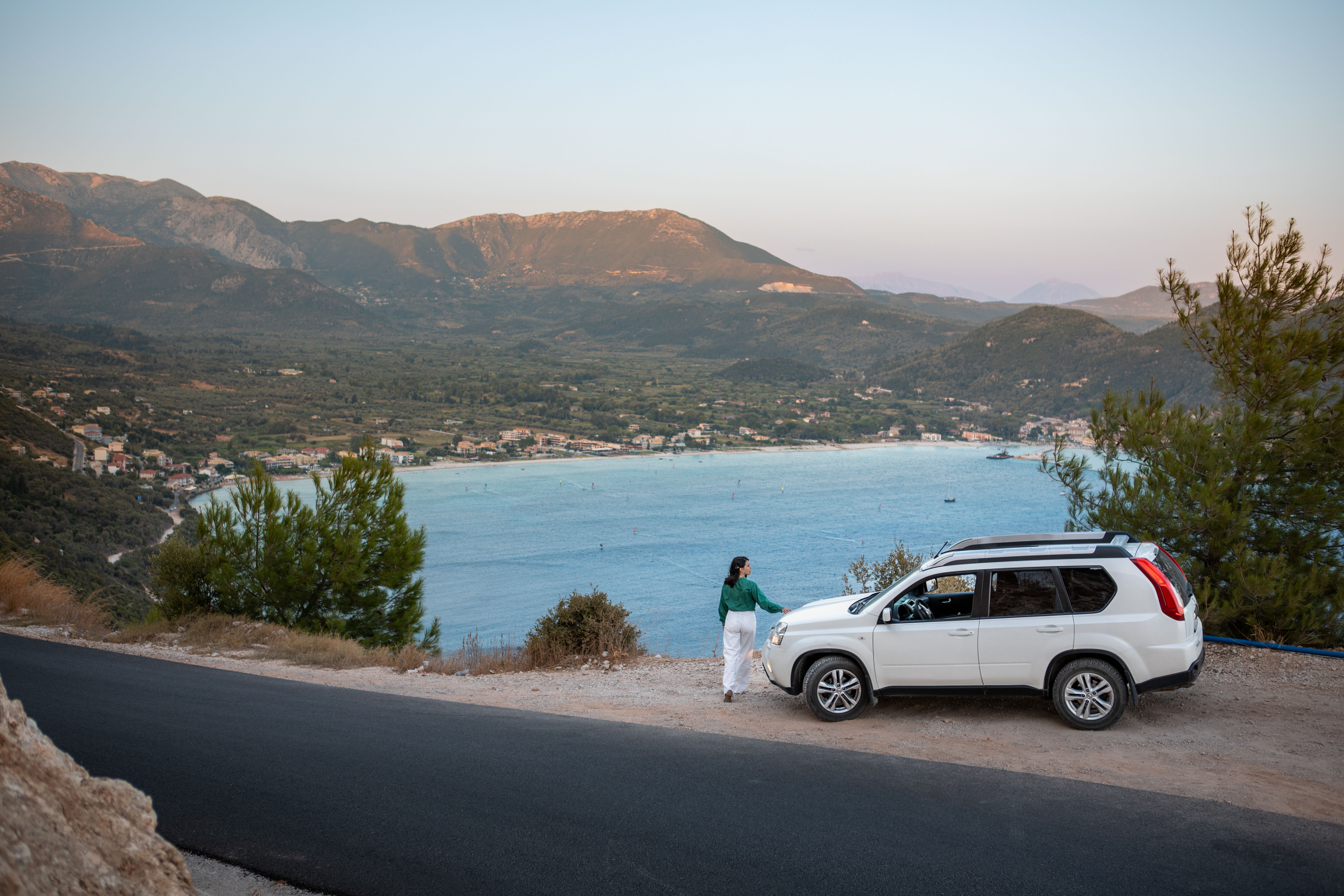 Plan Your Ideal Self‑Drive Tour: Expert Structure, Joyful Detours 3 car travel concept woman standing at the cliff lo f86d7231dd117d26917f BTOURS