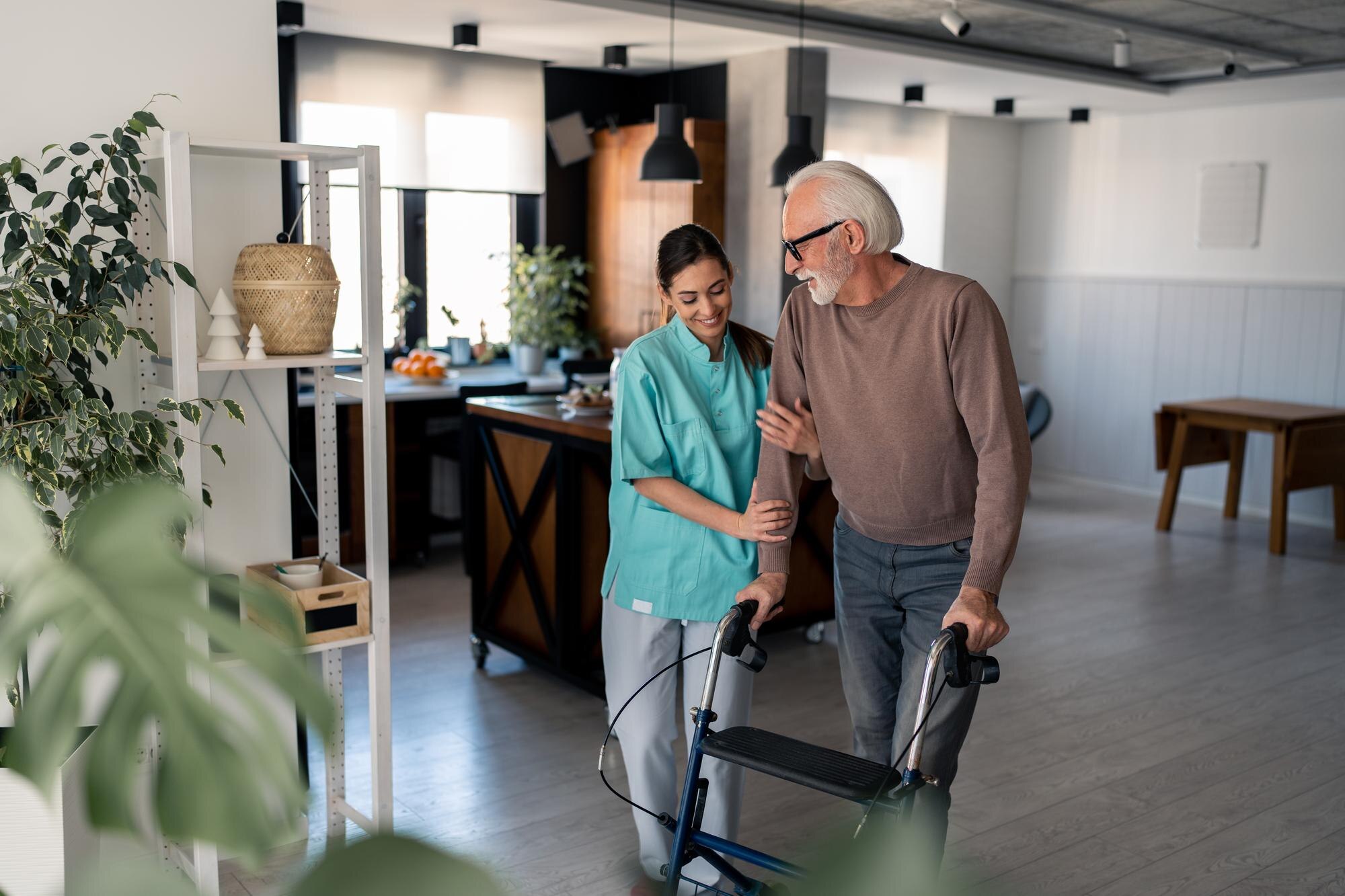 caring physiotherapist assisting elderly male pati c9049f32b530bf8f412b