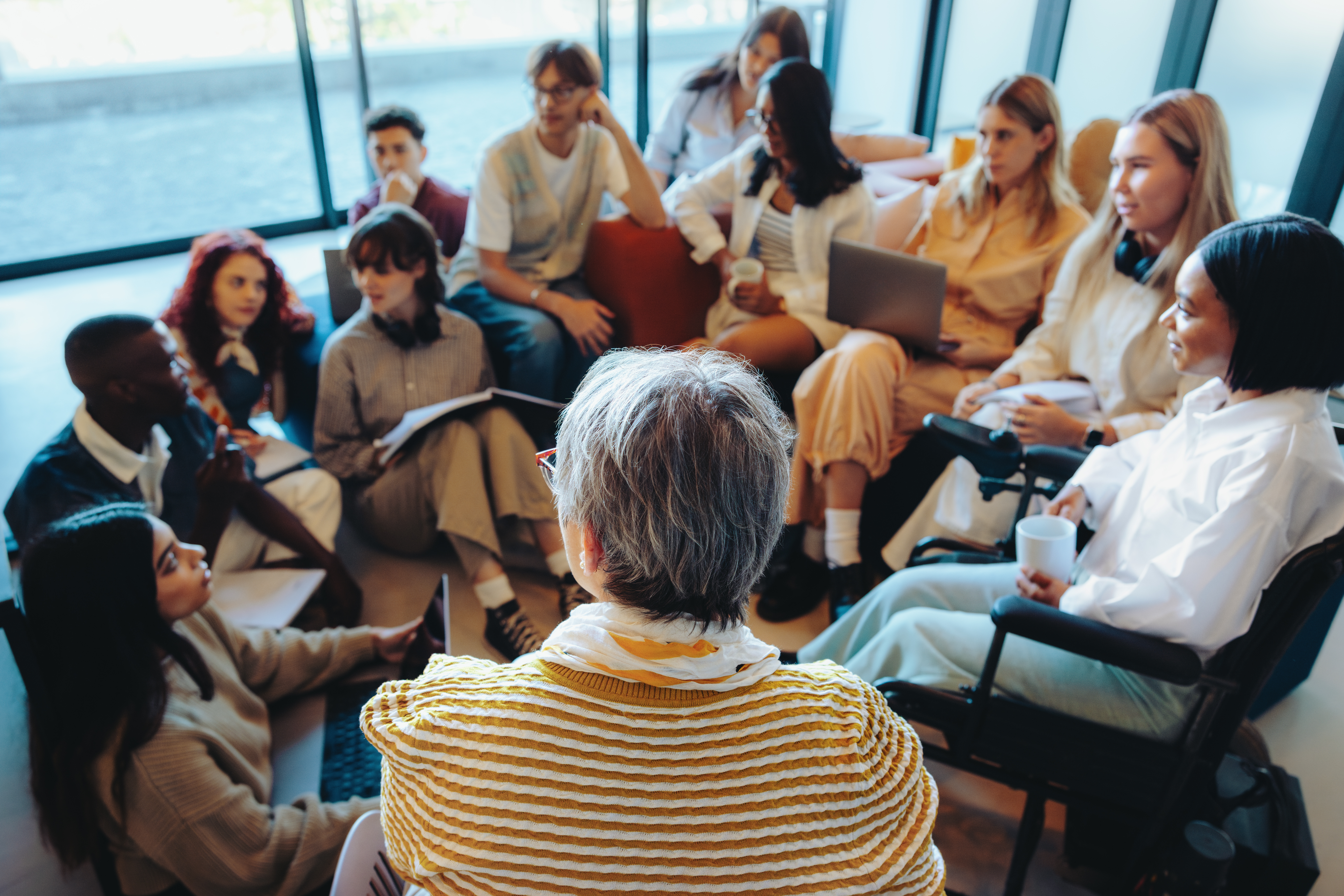 casual classroom setting with a diverse group of s c74831fb5f84ffb4f9f5