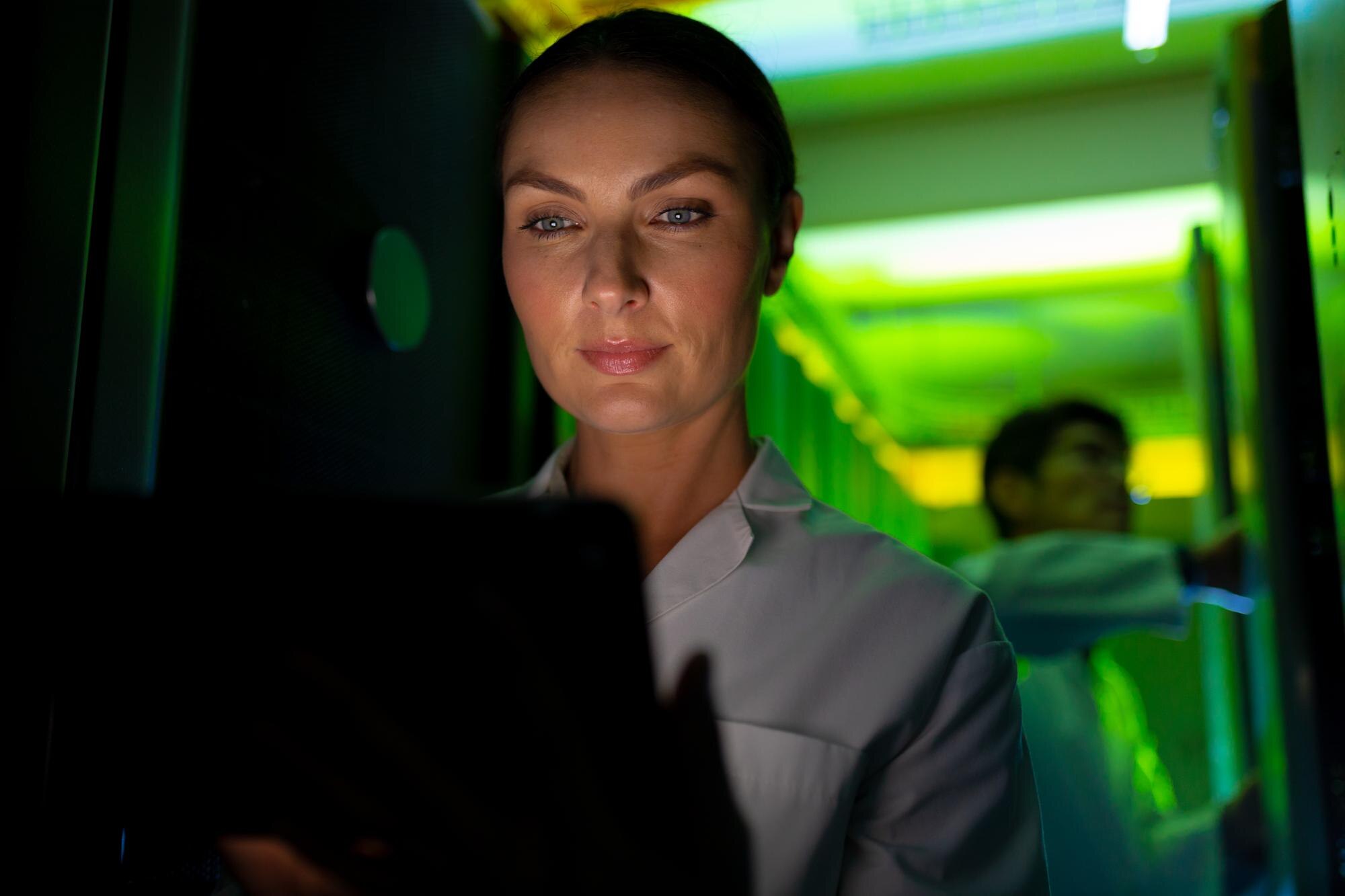 caucasian female engineer wearing an apron using l 2943fc15e12688e23a61
