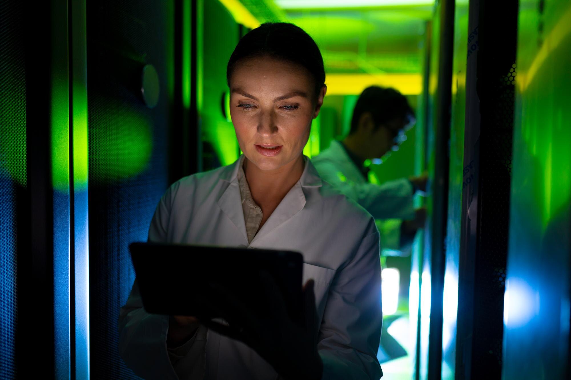 caucasian female engineer wearing an apron using l ef3b4baac3b23cf3883a