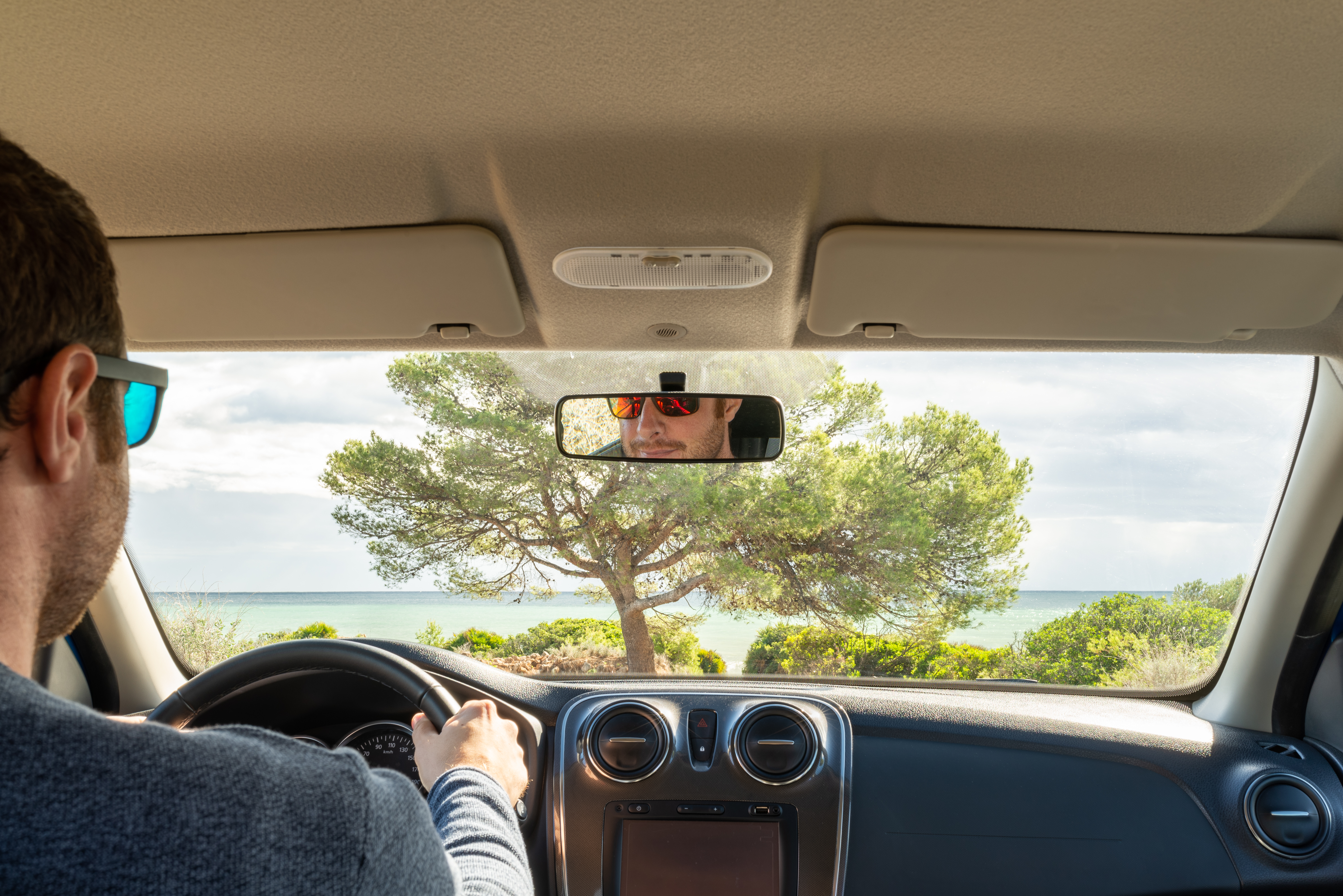 caucasian male driver inside his car looking at th 4dfca49af1155812e778 BTOURS