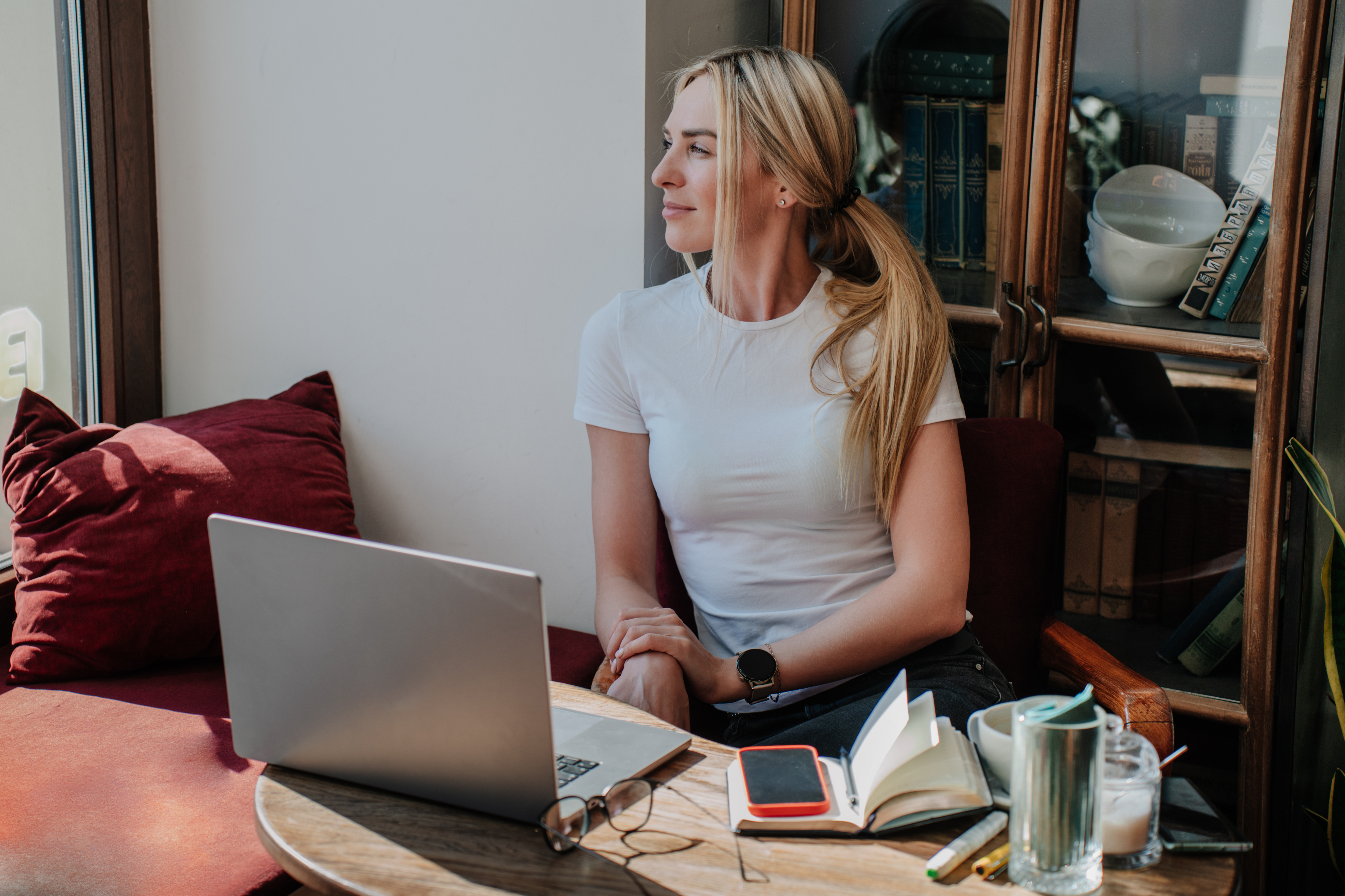 caucasian woman in a casual white tee working on a 360c4f55553ee15acdc0