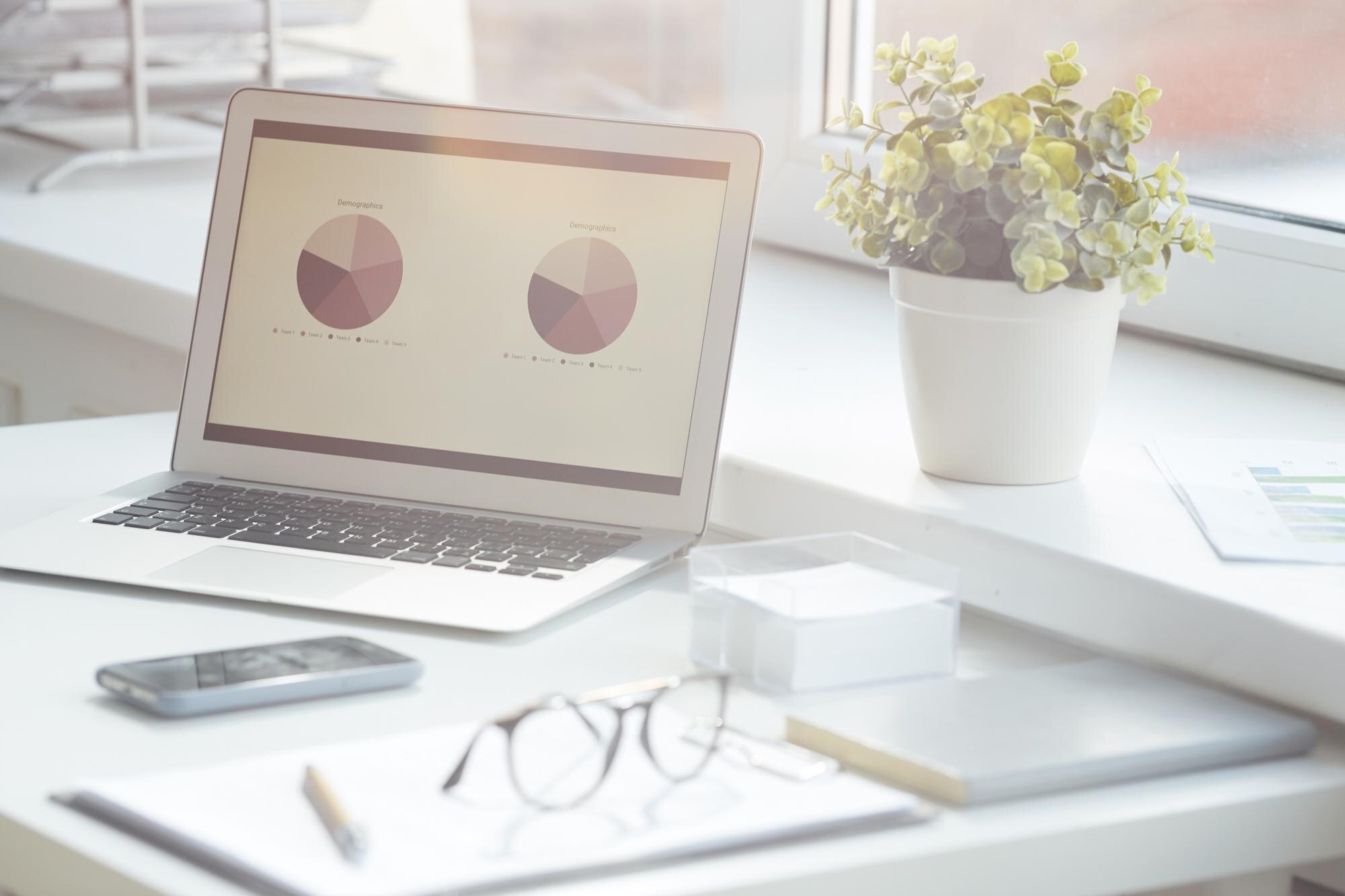 chart data presentation on laptop screen e1290f6b1c026fbd52f4