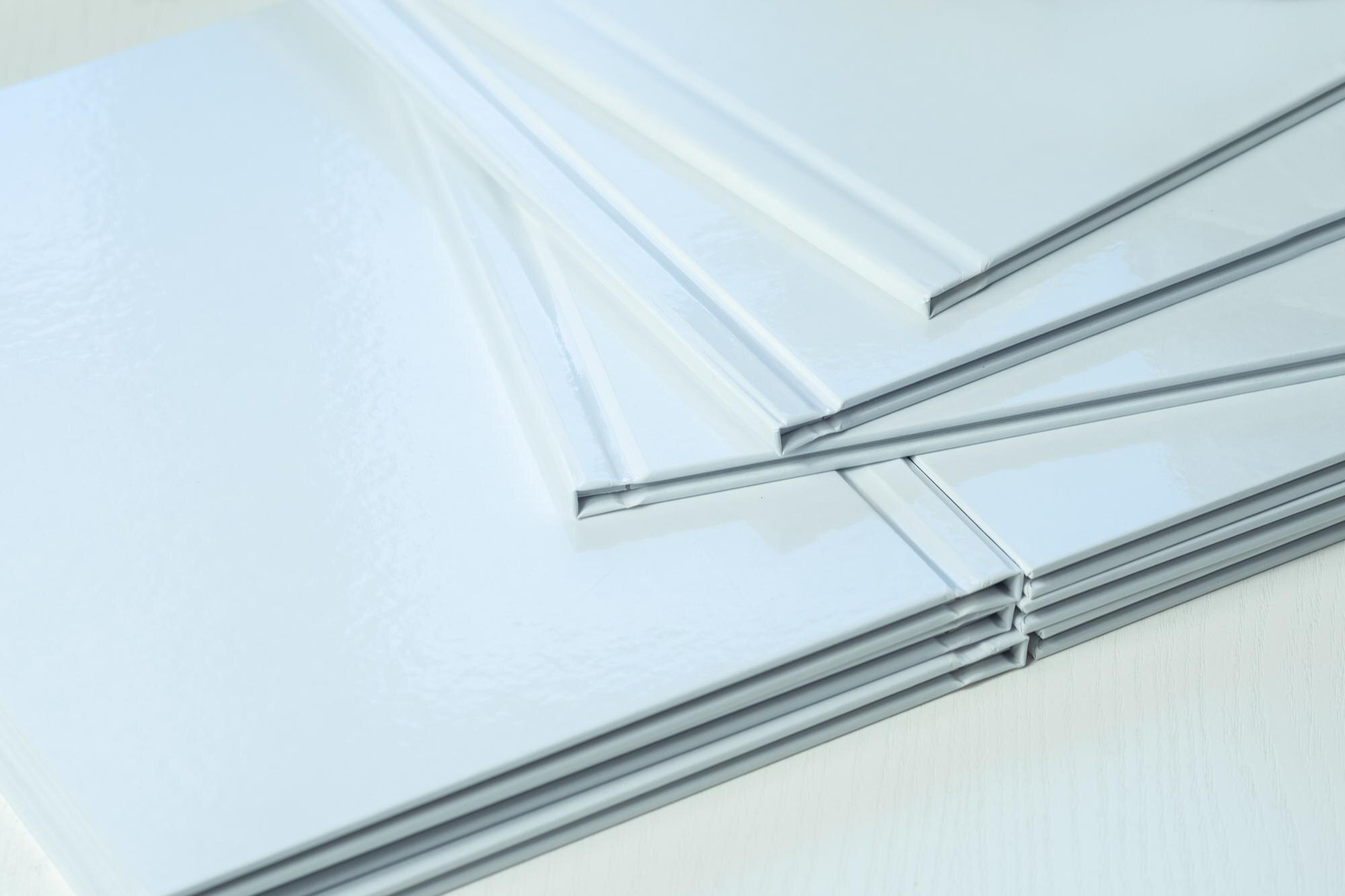 6 Benefits of Choosing Locally Manufactured Plastic Sheets in Australia 3 clean empty white spines of photo books closeup pa fc9a9e287413169ff086