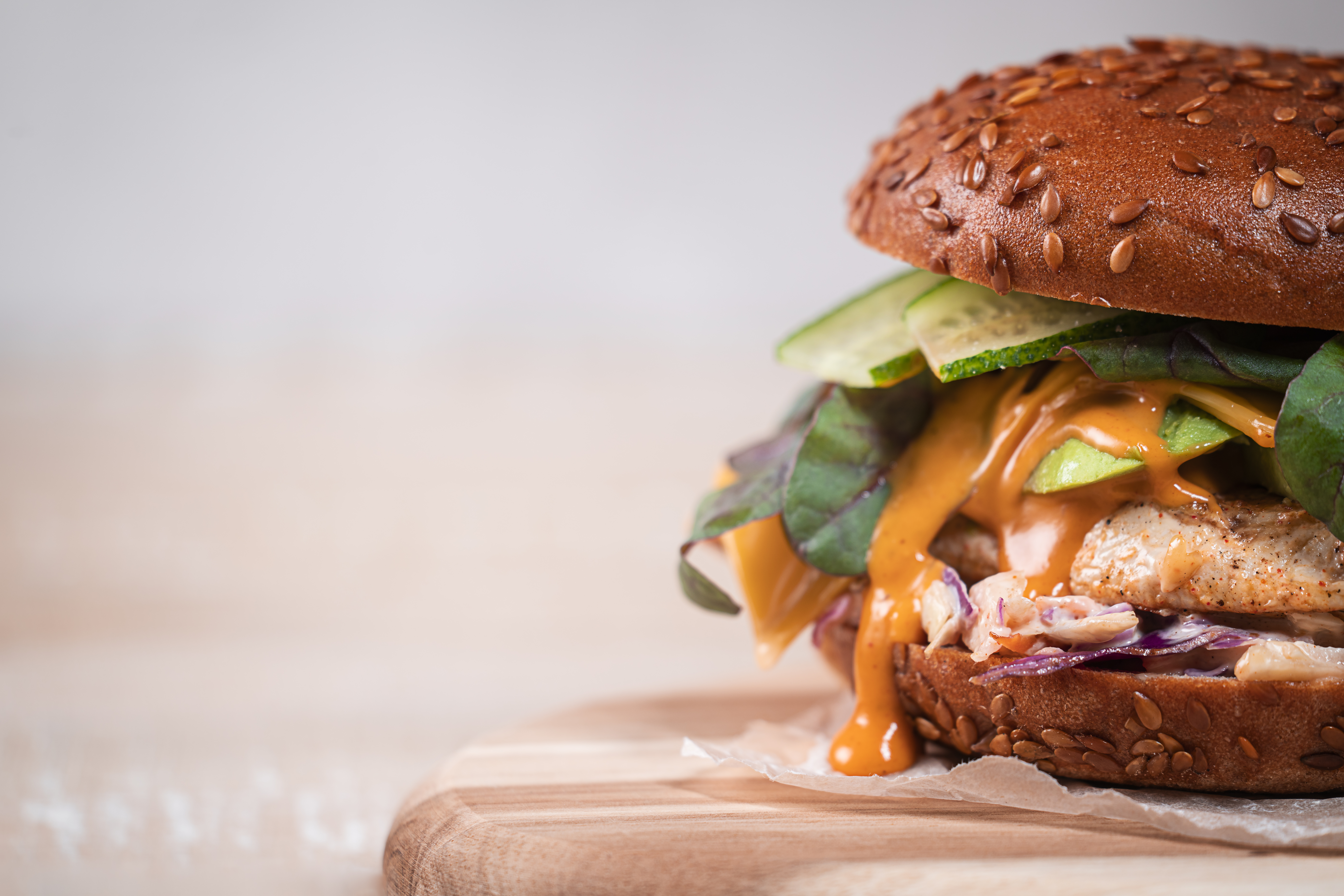 close up half of homemade burger with chicken brea 67dbd848391c64aee17d