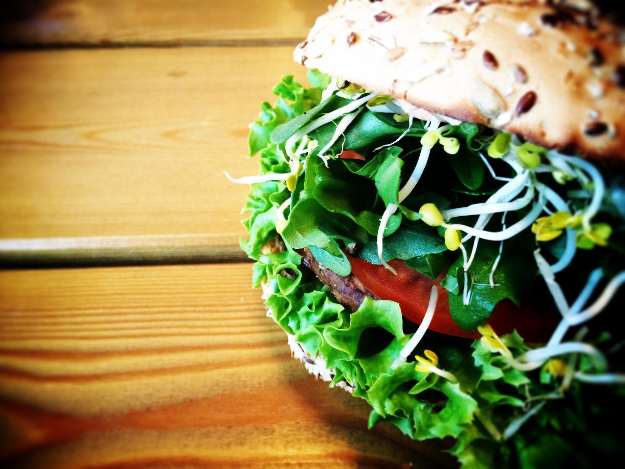 close up of burger on table ce3b230dcb876df44c31
