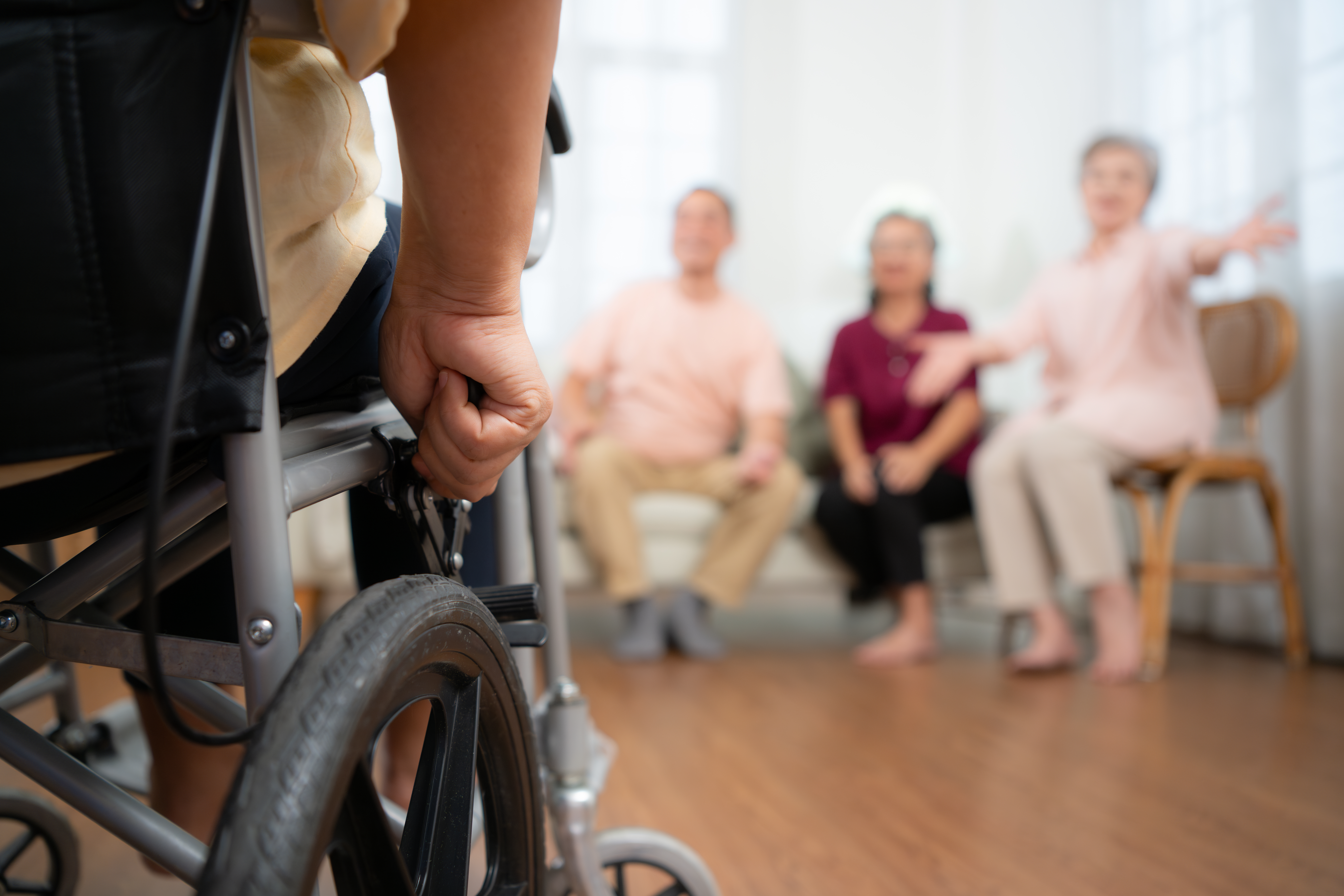 close up of senior woman in wheelchair with her ca 7e069feb7a044eeee57f