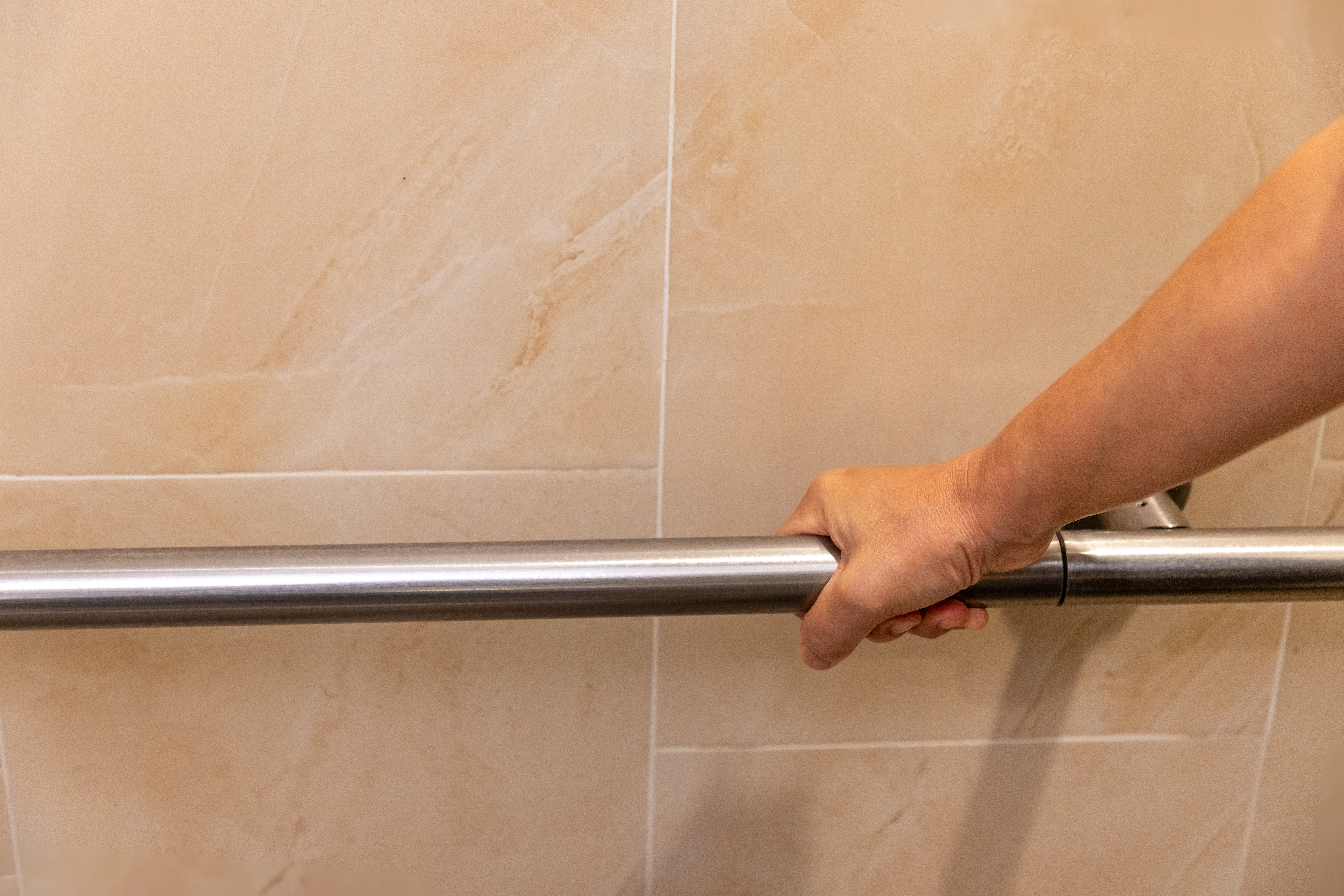 close up of senior woman s hands holding a bathroo 0d757eb12f63f5a34492