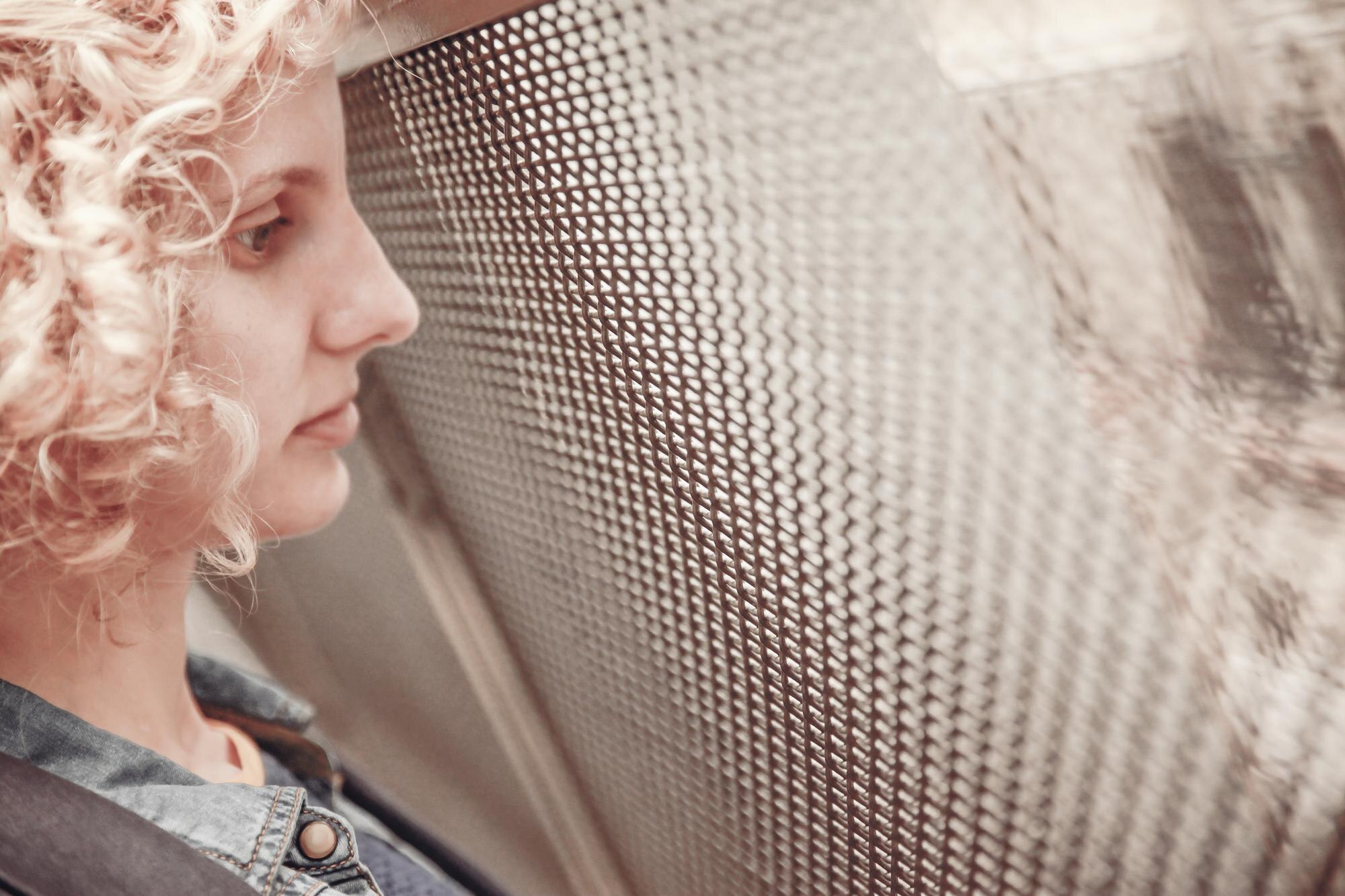 Advantages of Custom Plastic Fabrication for Trade and Industry in Australia 3 close up of woman looking through glass window f13416ad88af172d523e