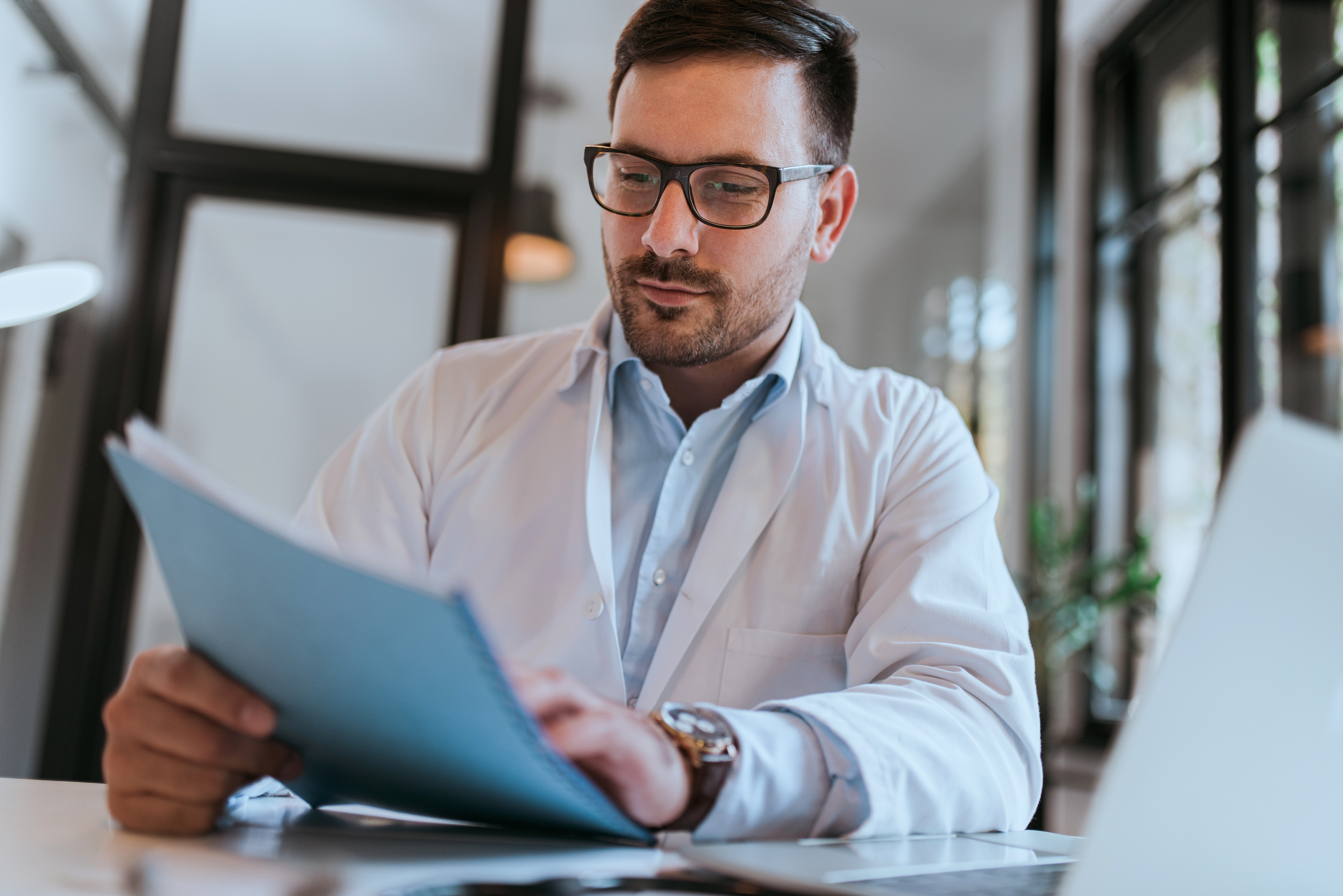 Doctor reviewing monthly performance