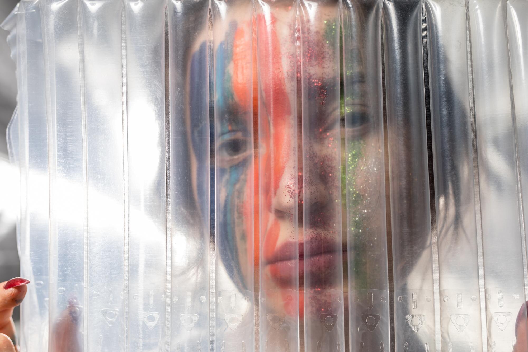 The real cost of cheap plastics: how to spot and avoid hidden expenses 2 close up portrait of woman with painted face seen 47da3506c017c155e18d