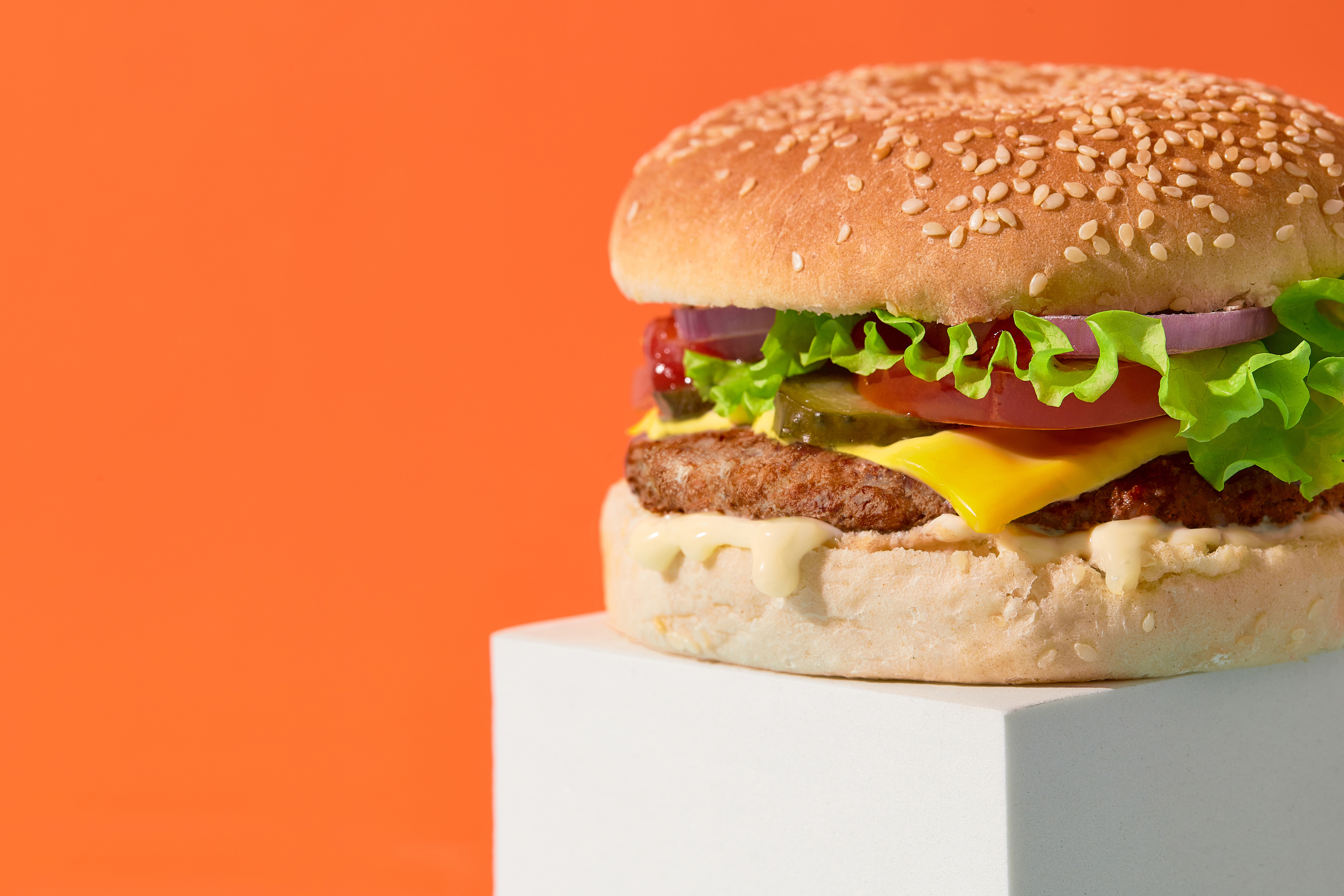 close up fresh tasty burger on orange background fe21b936bfb30d5510dc