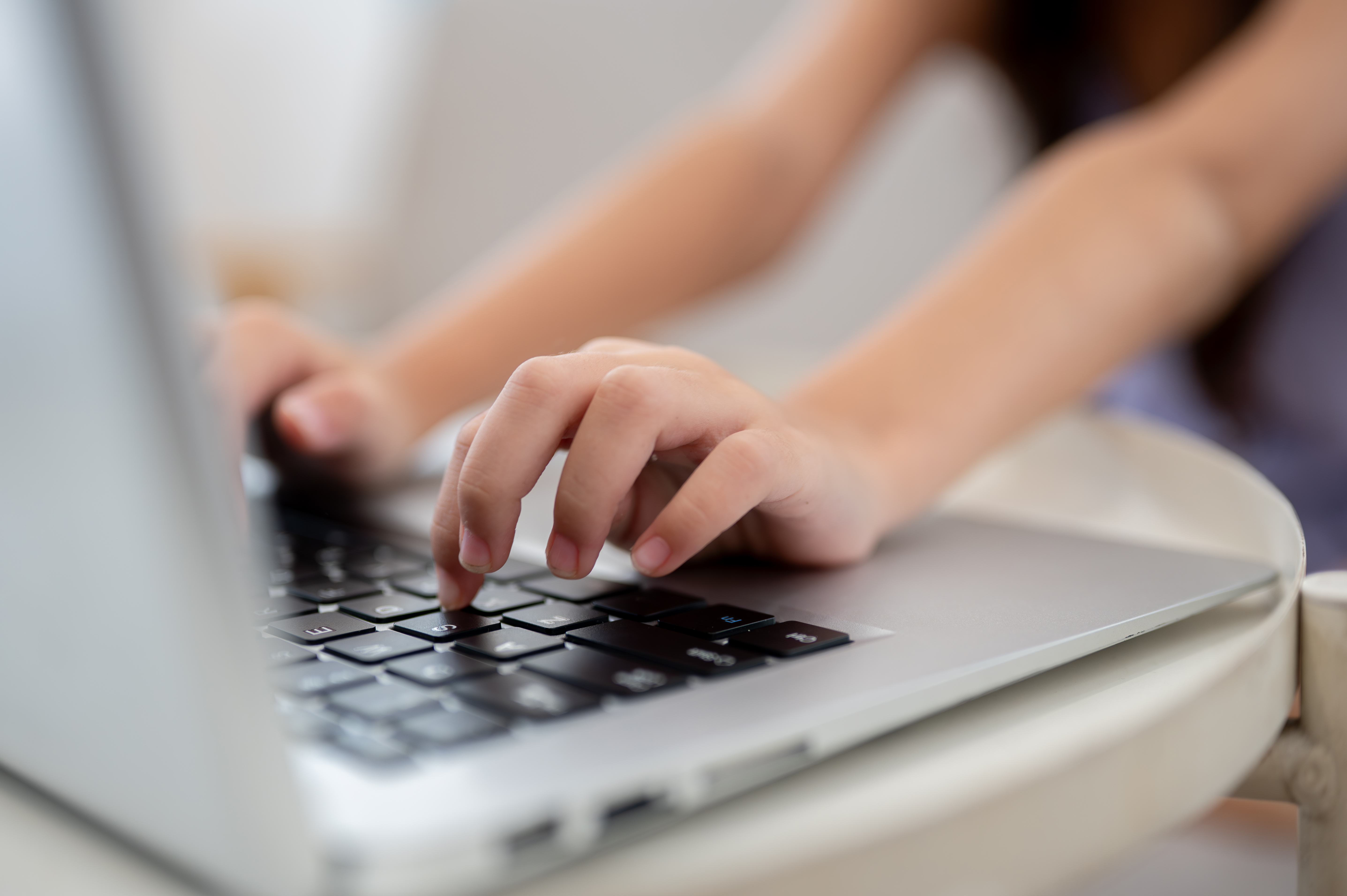 Close Up Of A Pair Of Kid Hands Typing On Laptop O Ff607f250a5e059db58b
