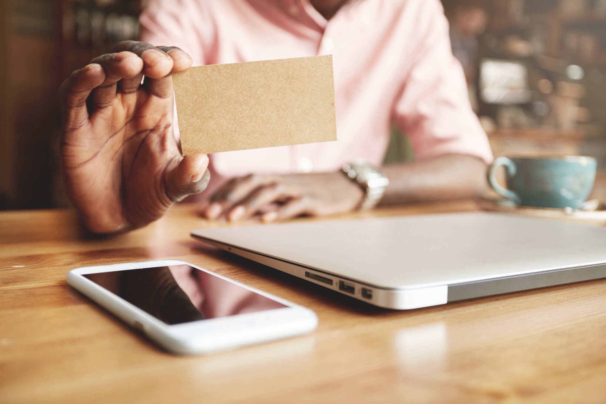 Digital business cards for local businesses and start-ups: one tap, more leads 2 close up of black male hands holding blank parchme 546b6f7cef1d8e24d341