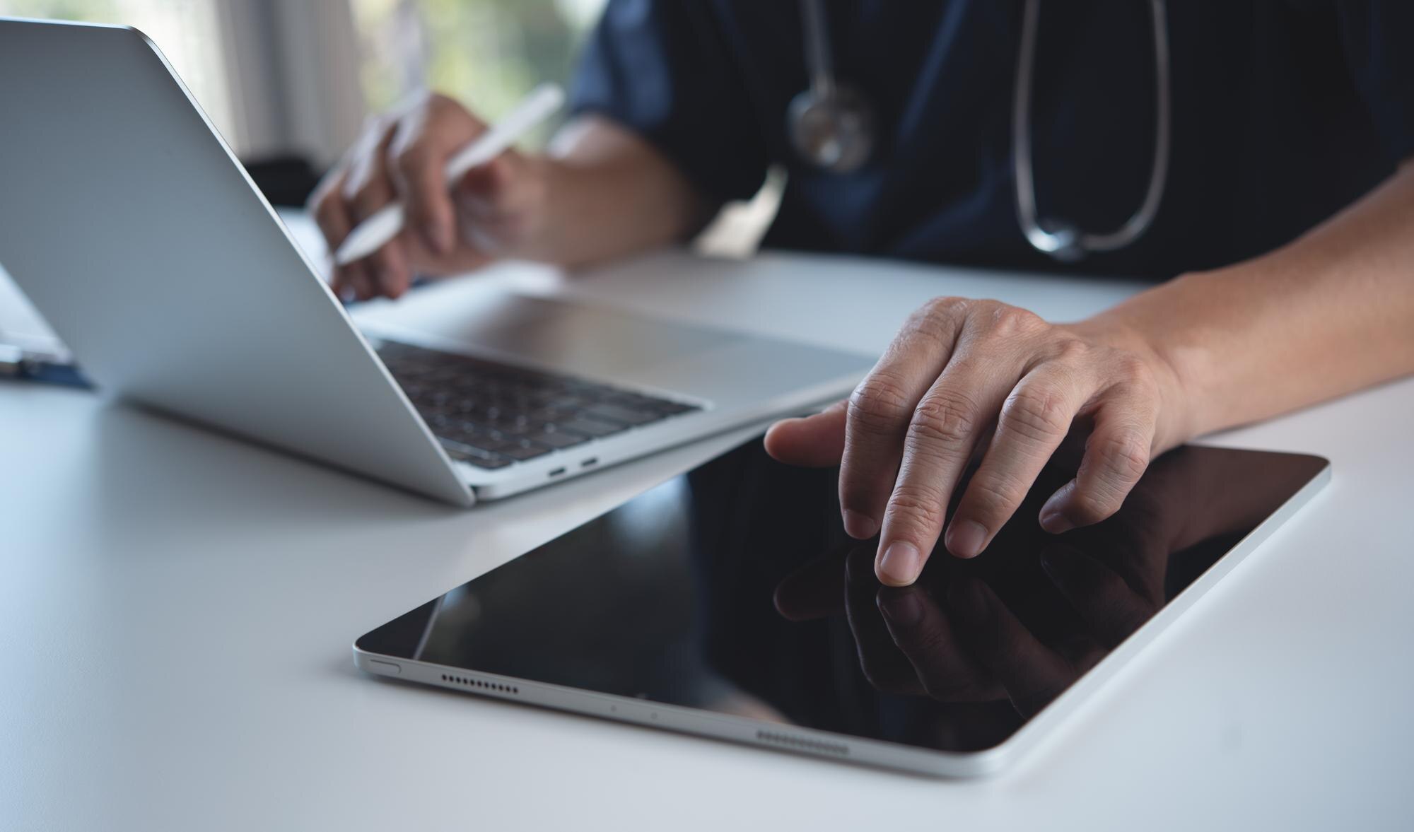 close up of doctor surgeon using digital tablet an 888f0a8ecf7ddce44c2b - MedWell Digital Marketing Agency