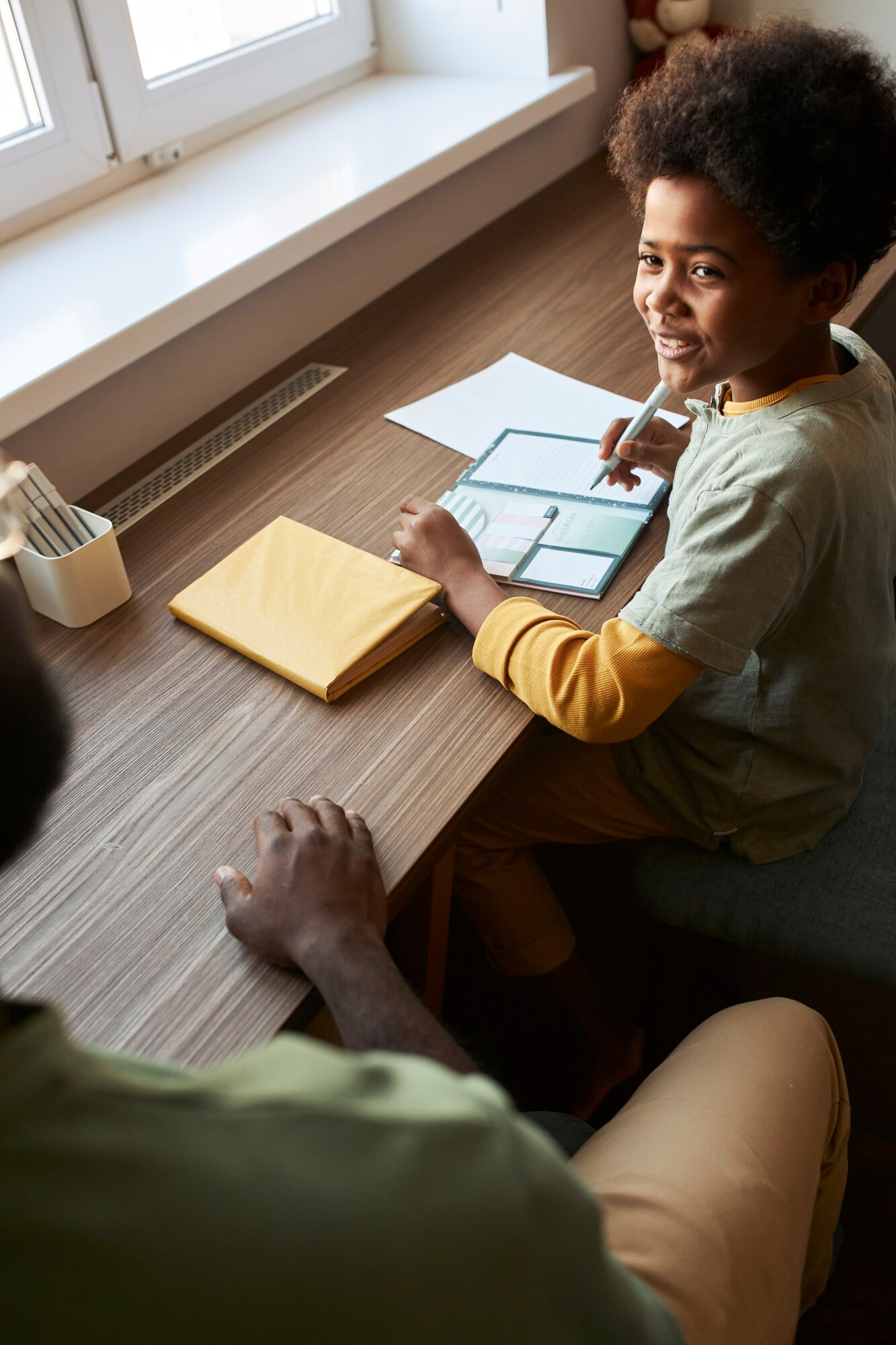 Close Up Smiley Kid Doing Homework E4f88f18f56fe08fcd60