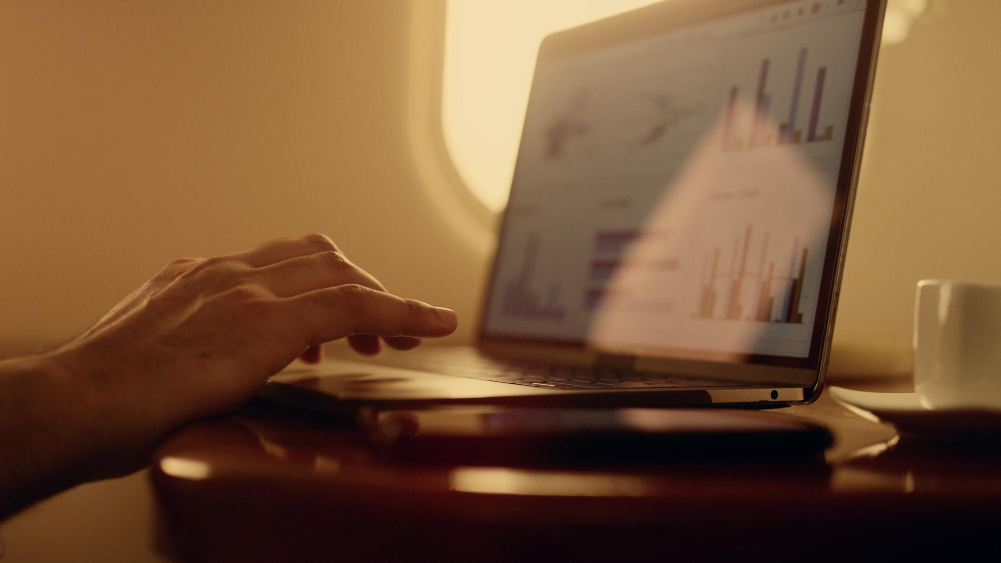 closeup hands touching touchpad on laptop manager c881f5d80c7bc294fa34