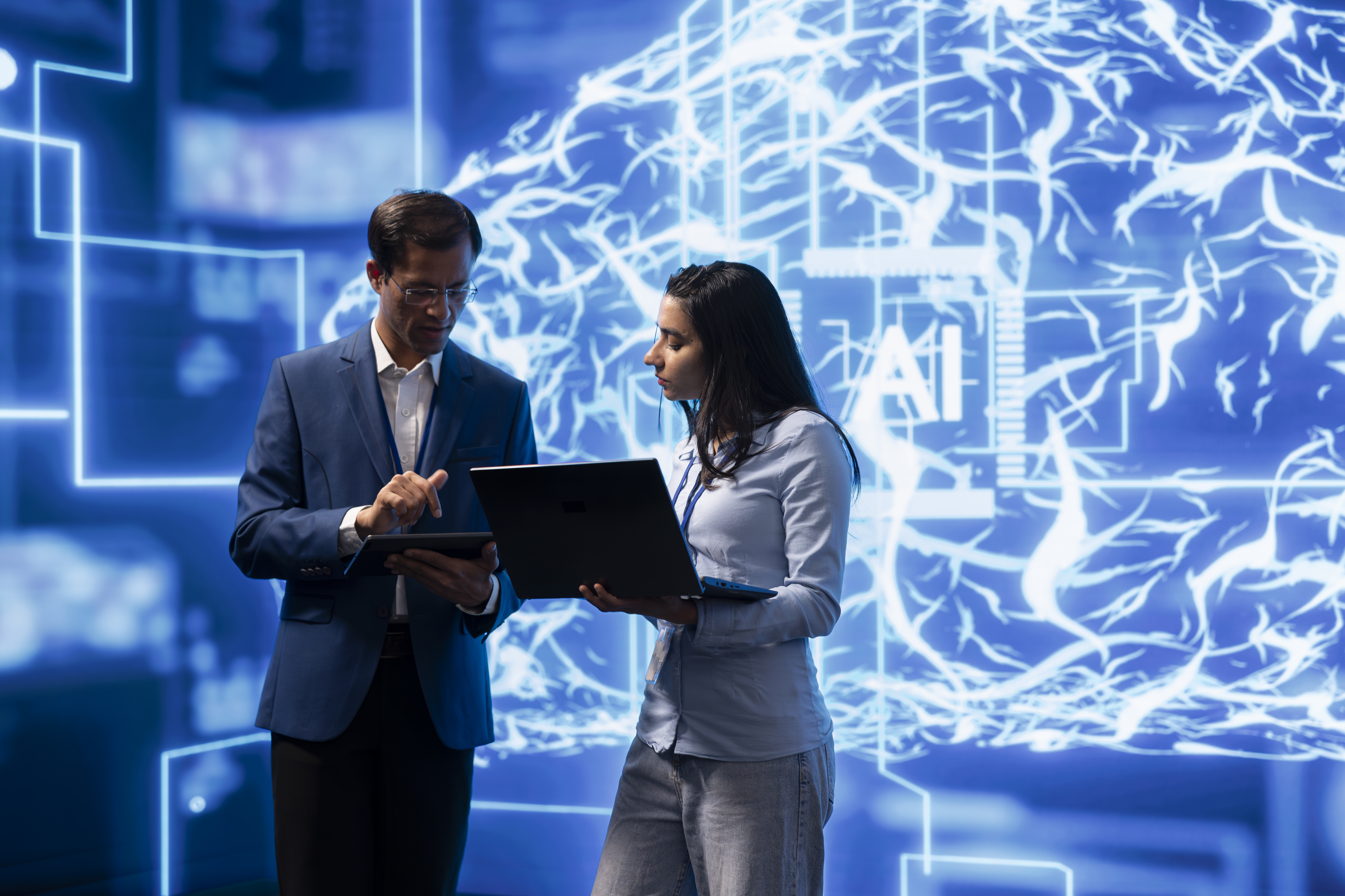 Colleagues discussing AI-driven solutions for local SEO, with a digital backdrop featuring neural network imagery and the word "AI."