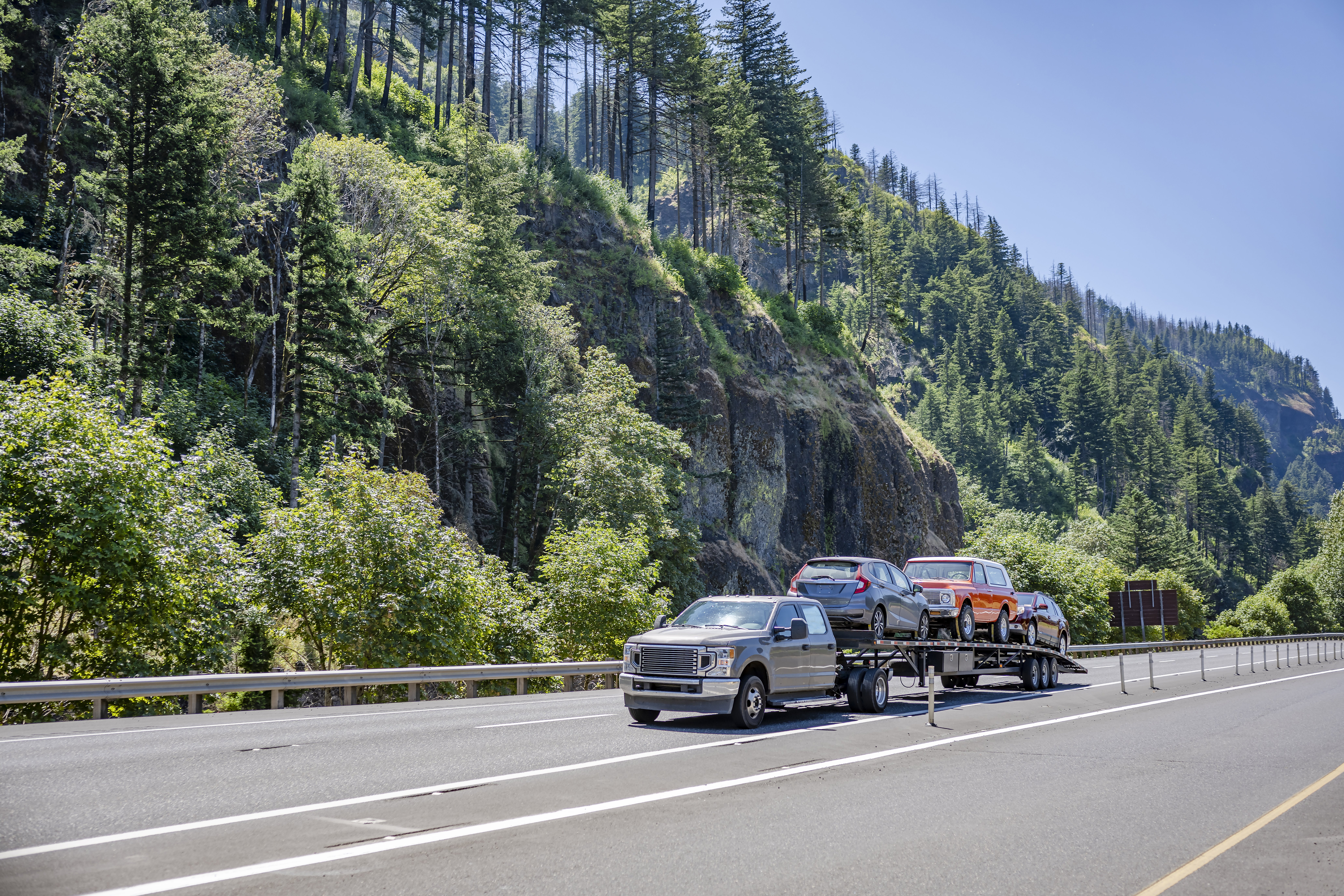 compact truck transporting cars on the small semi 0da75701558d4c99197d