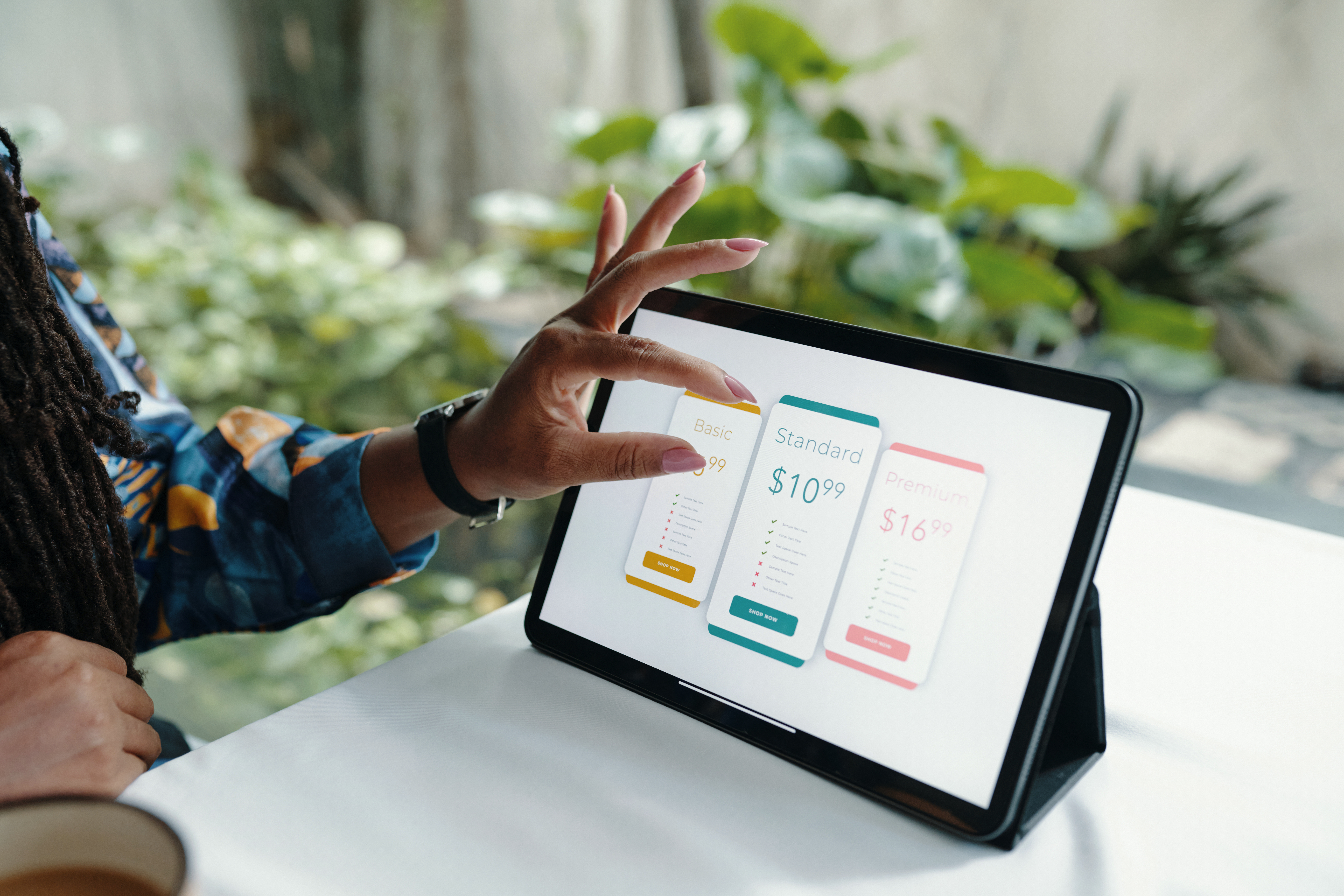comparing pricing plans on digital tablet device c57004a67918dd8c13c8