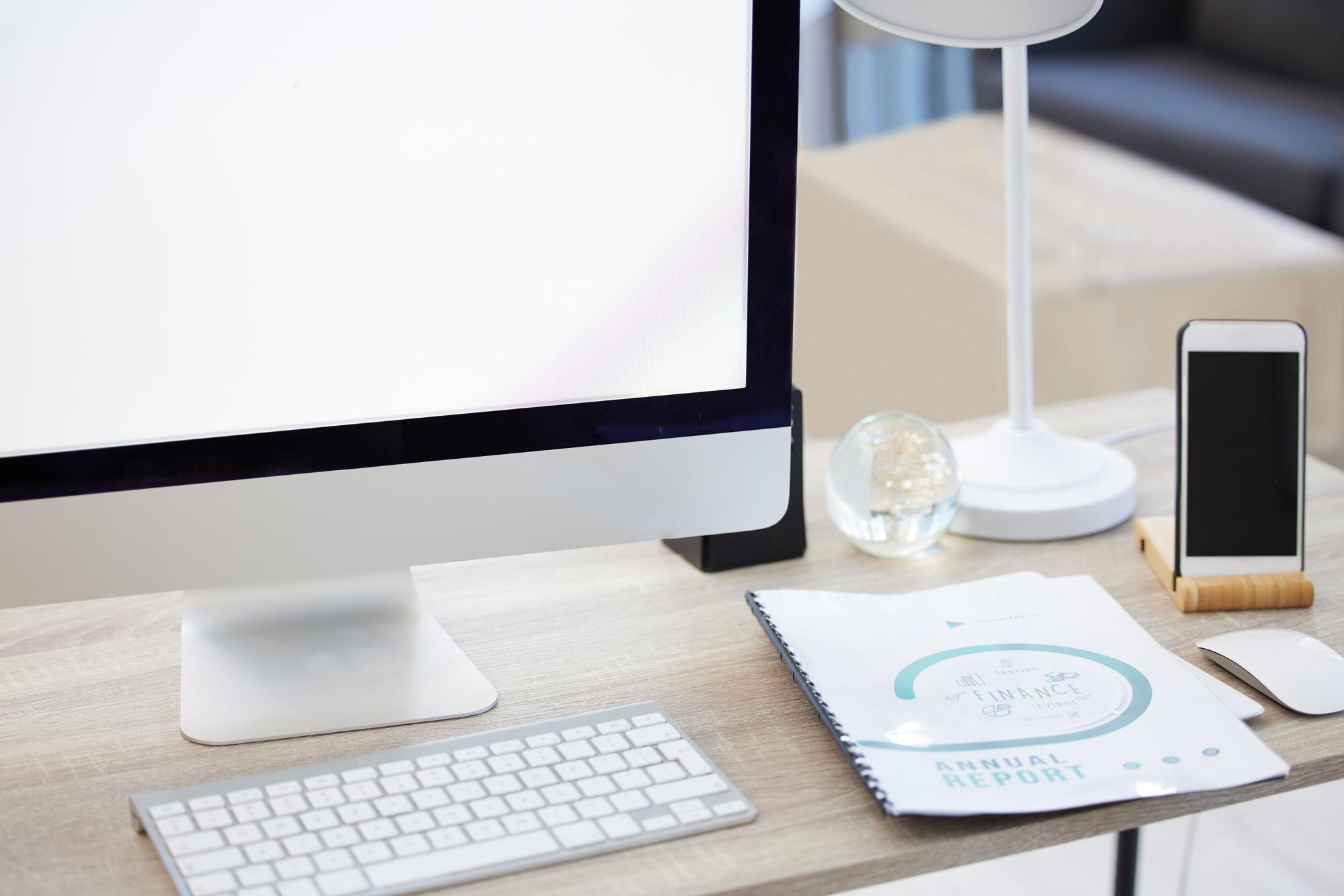 computer smartphone and documents at workstation i 3ea05fe773160c530e0c