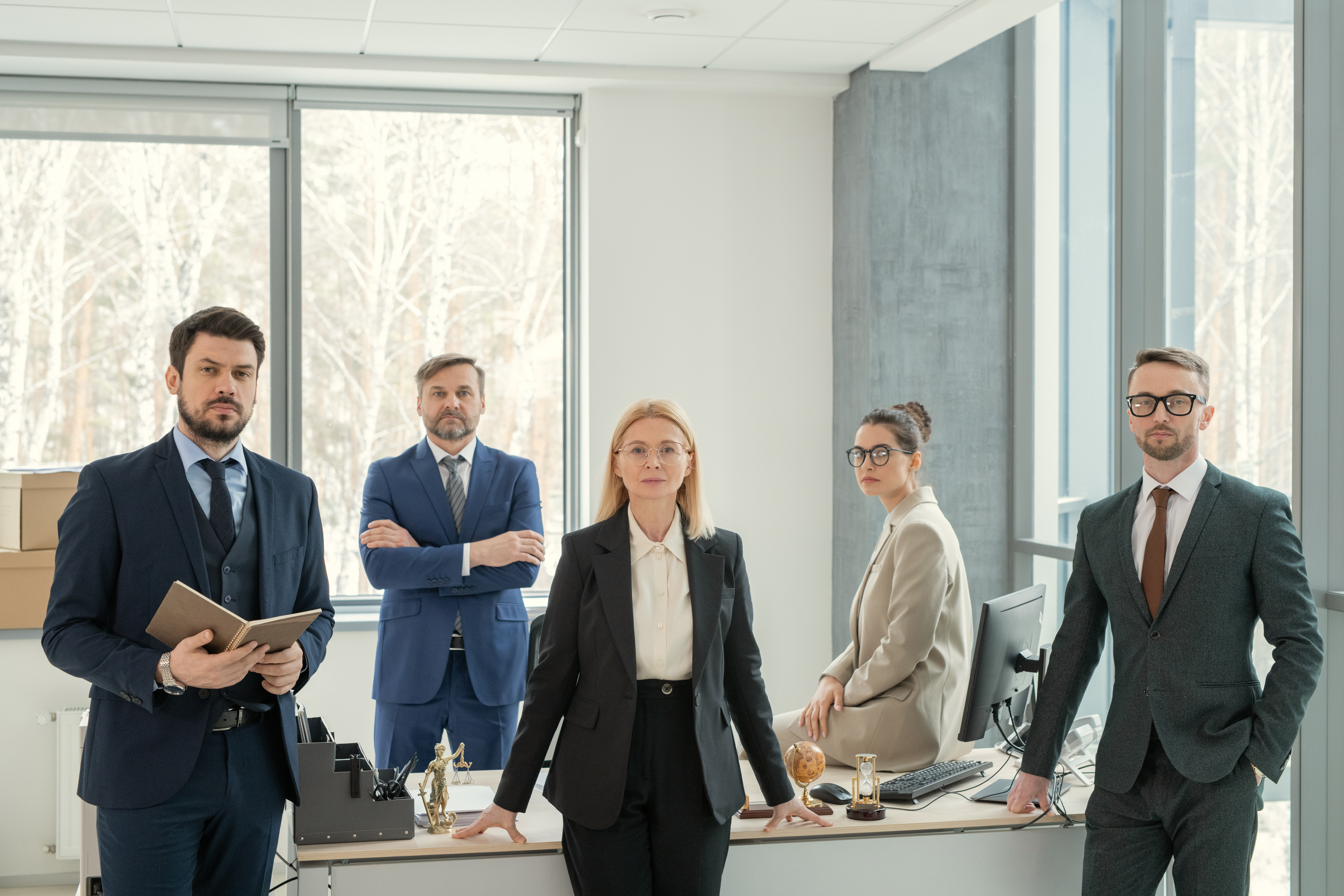 confident business colleagues posing at office tab 5ec0867813db317a441c