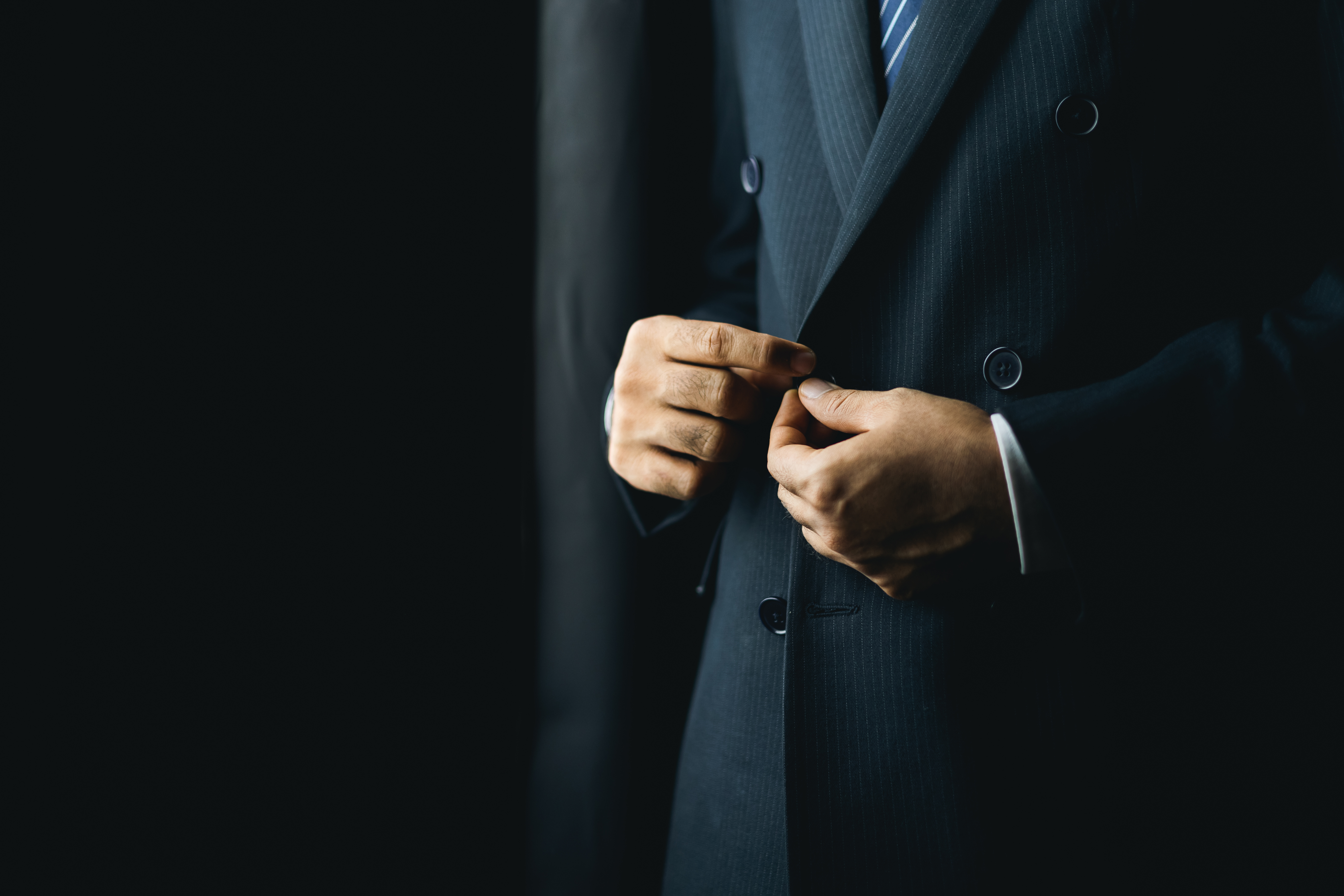 Confident Businessman Buttoning Or Adjust Classic E22c56939a5adad253fe