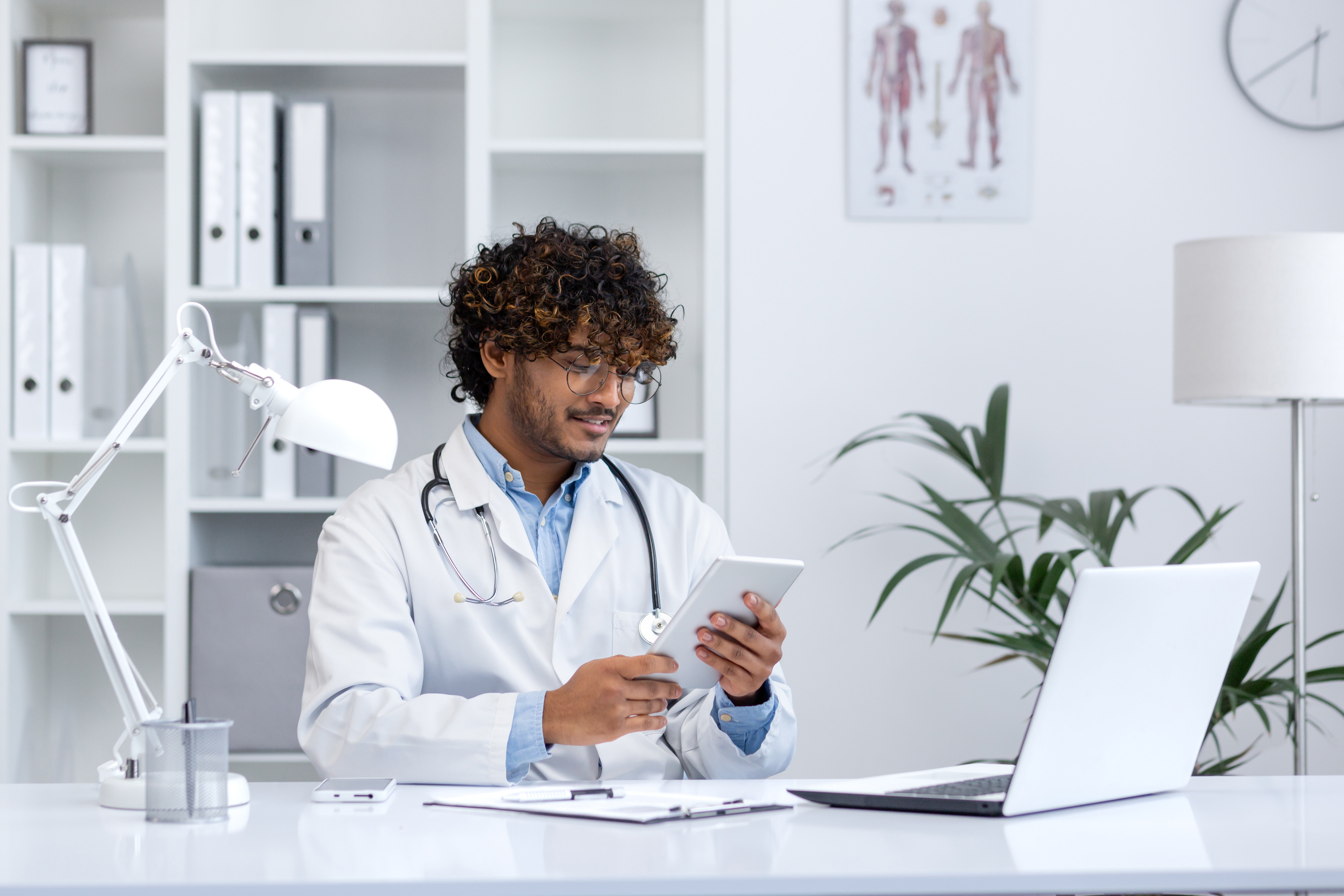 Building a Strong Visual Identity for Wellness Professionals 1 - MedWell Digital Marketing Agency confident young doctor in medical office using dig 547a8d66780331ccc646 - MedWell Digital Marketing Agency