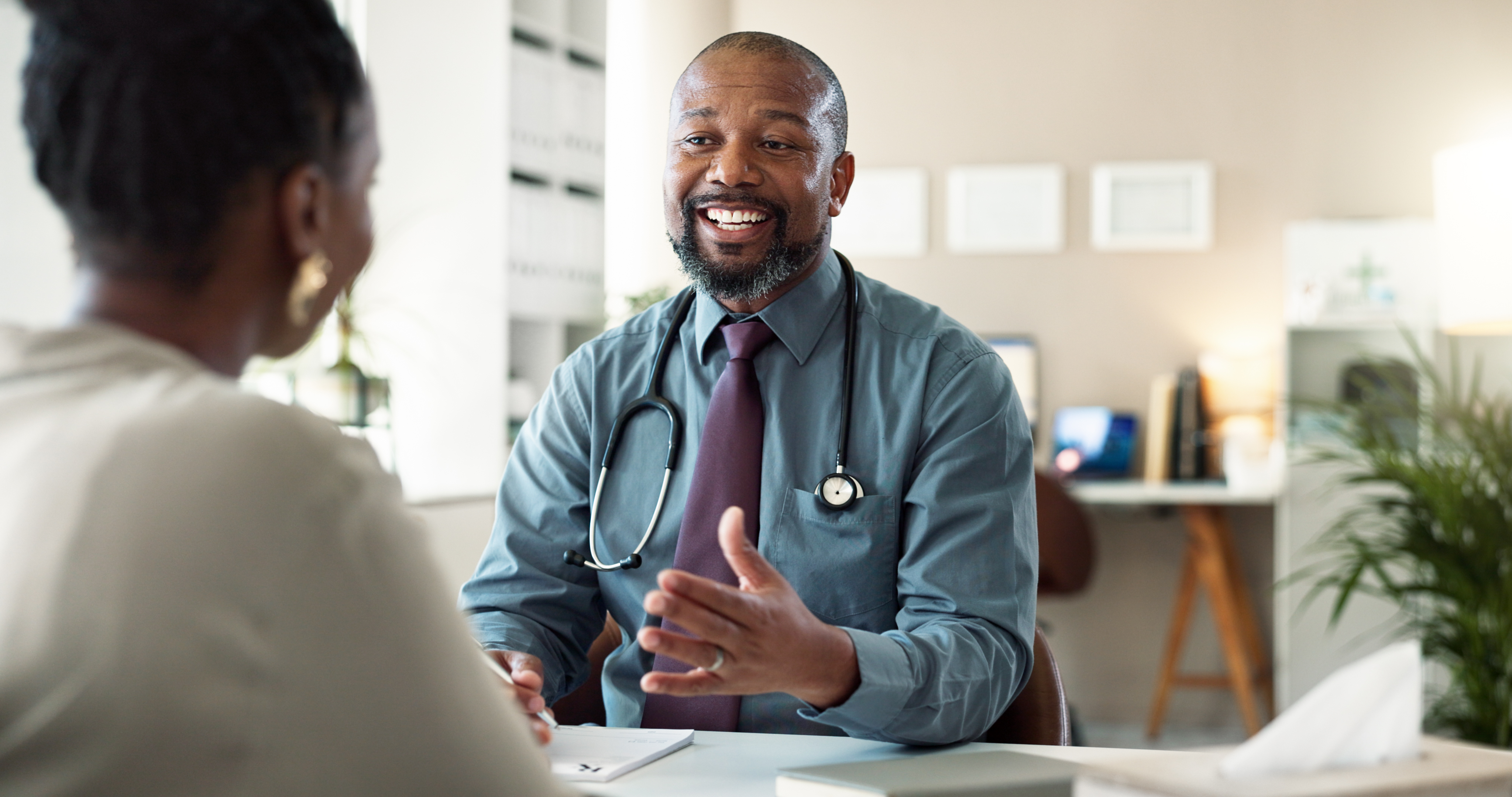 Physician talking with healthcare consultant about the steps to start a private practice