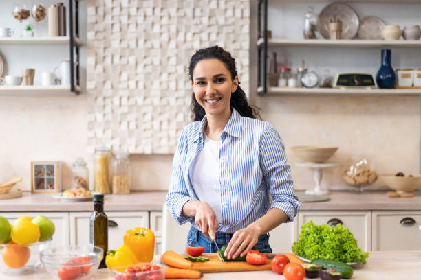 Cooking At Home Happy Latin Woman Preparing Veget 69D7Fd161208F6279050