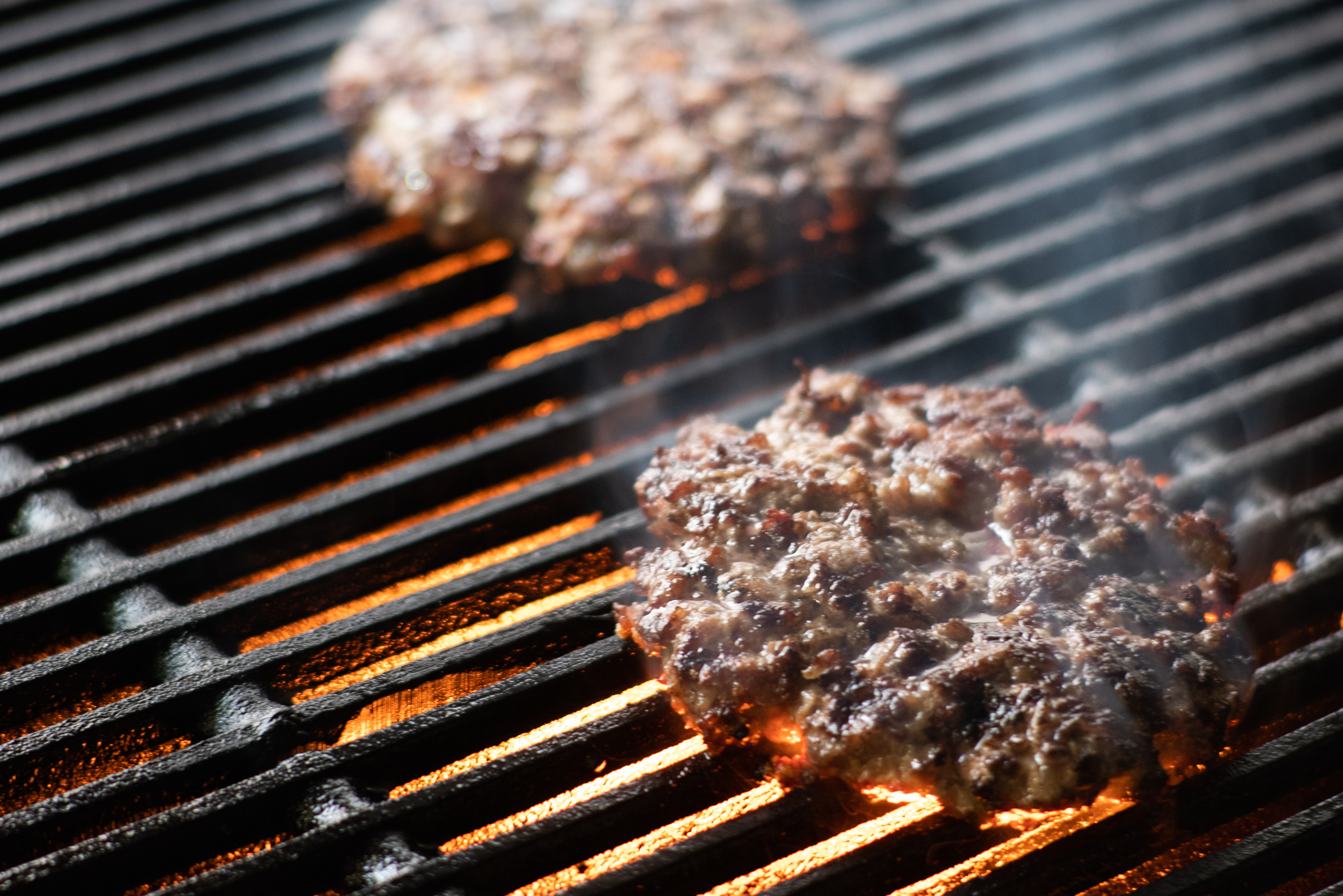 The Secret to Delicious Fast Food: Char-Broiled Goodness at Jubilee Juice & Grill! 1 cooking burgers on hot grill with flames 61d89e30f5a568e738da