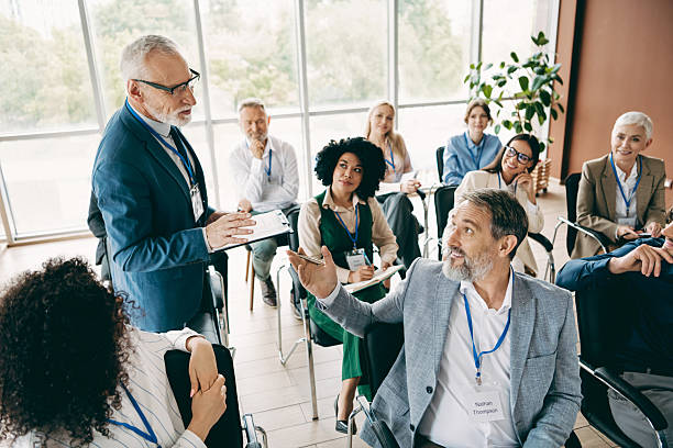 corporate meeting featuring a diverse team of prof 4b483755501cc94403aa
