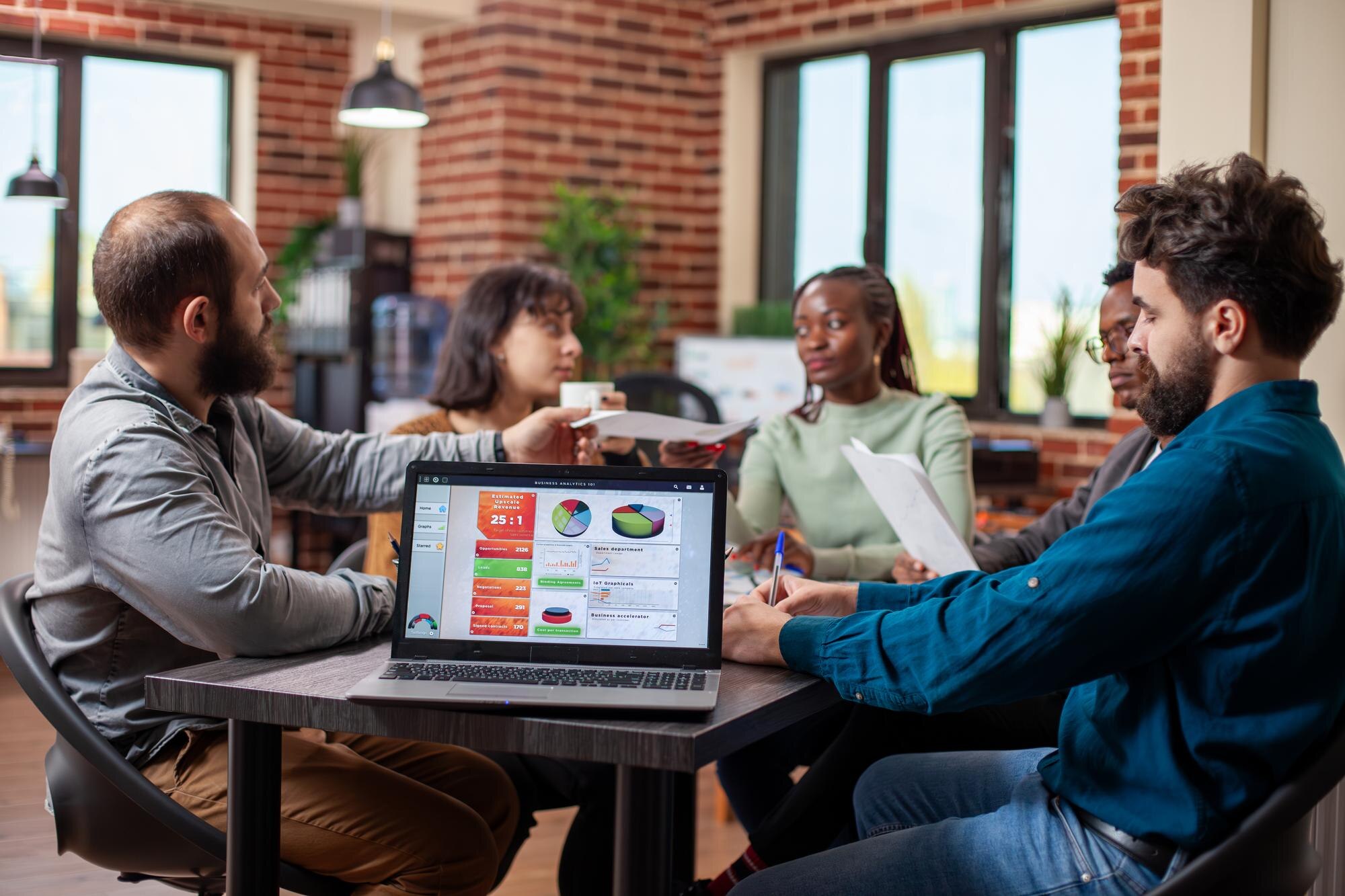 Boost Your SEO with a Seamless User Experience: A Winning Formula 36 coworkers sit around table with a laptop fde2da36538f72cfbae2