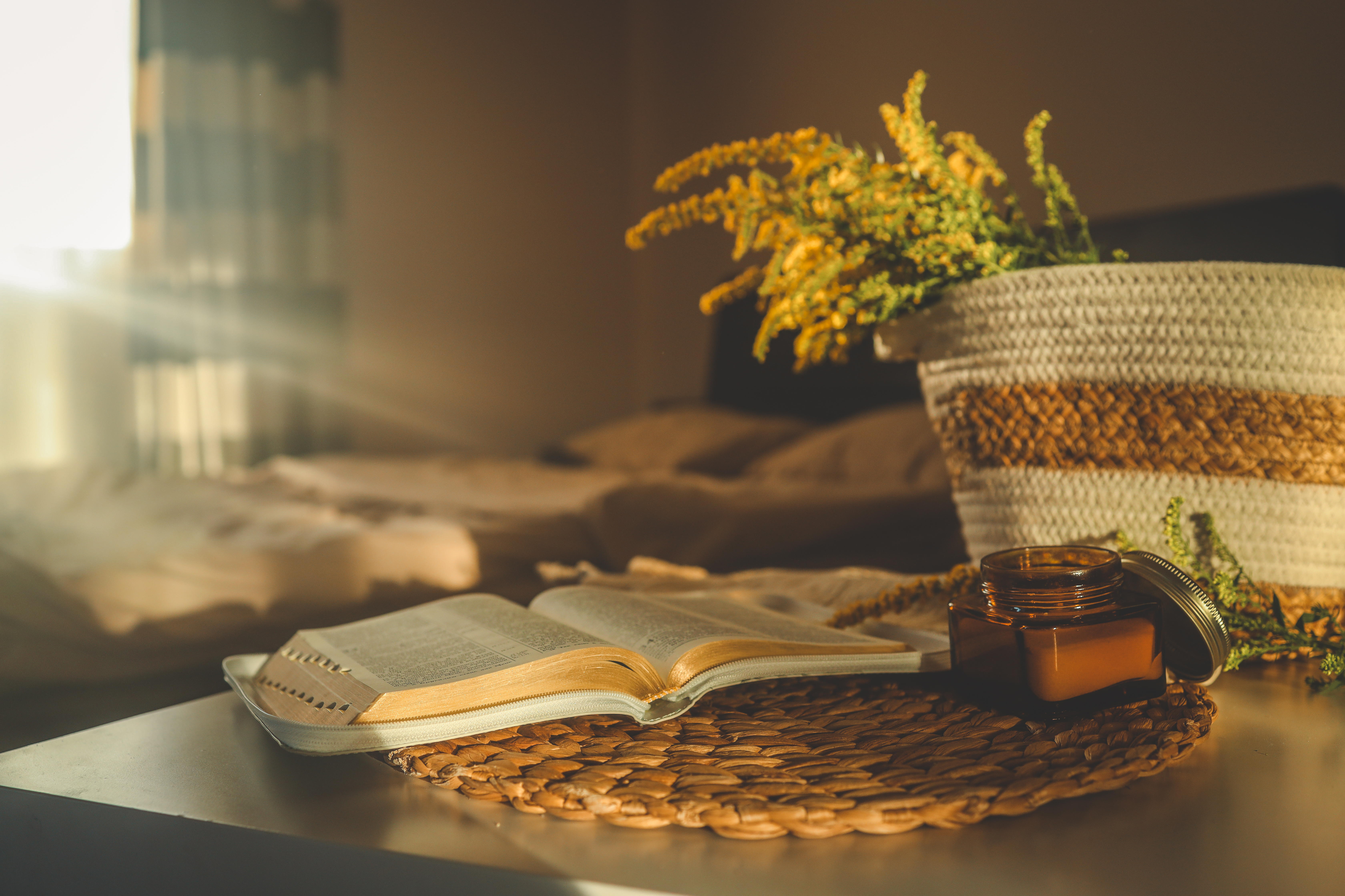 cozy home scene with a burning candle in an amber 6a62aa1fd417baec64d4