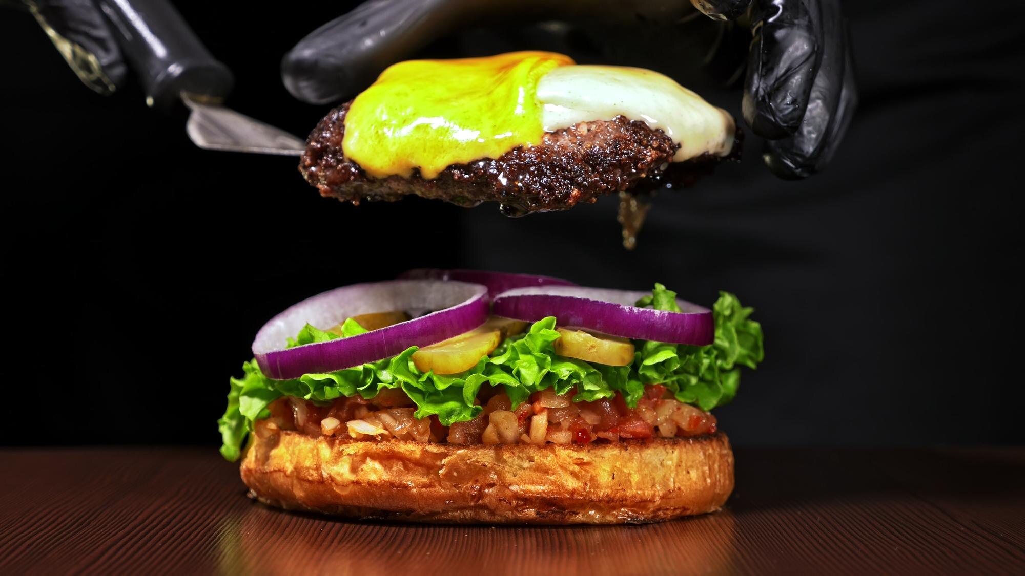 craft burger is cooking on black background consis f5dc177716b57b2c5156