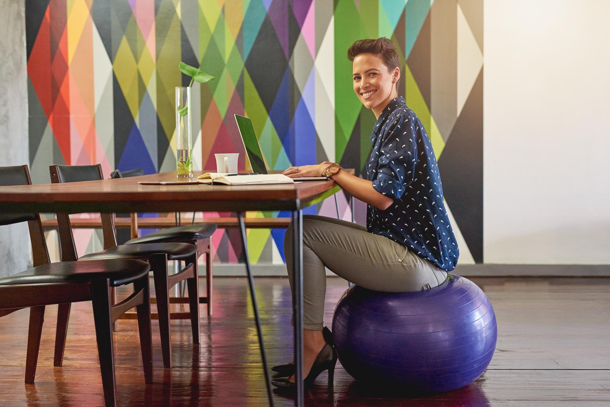 creative laptop and smile with woman on ball in mo 6b3edf5463c2e14d7b64