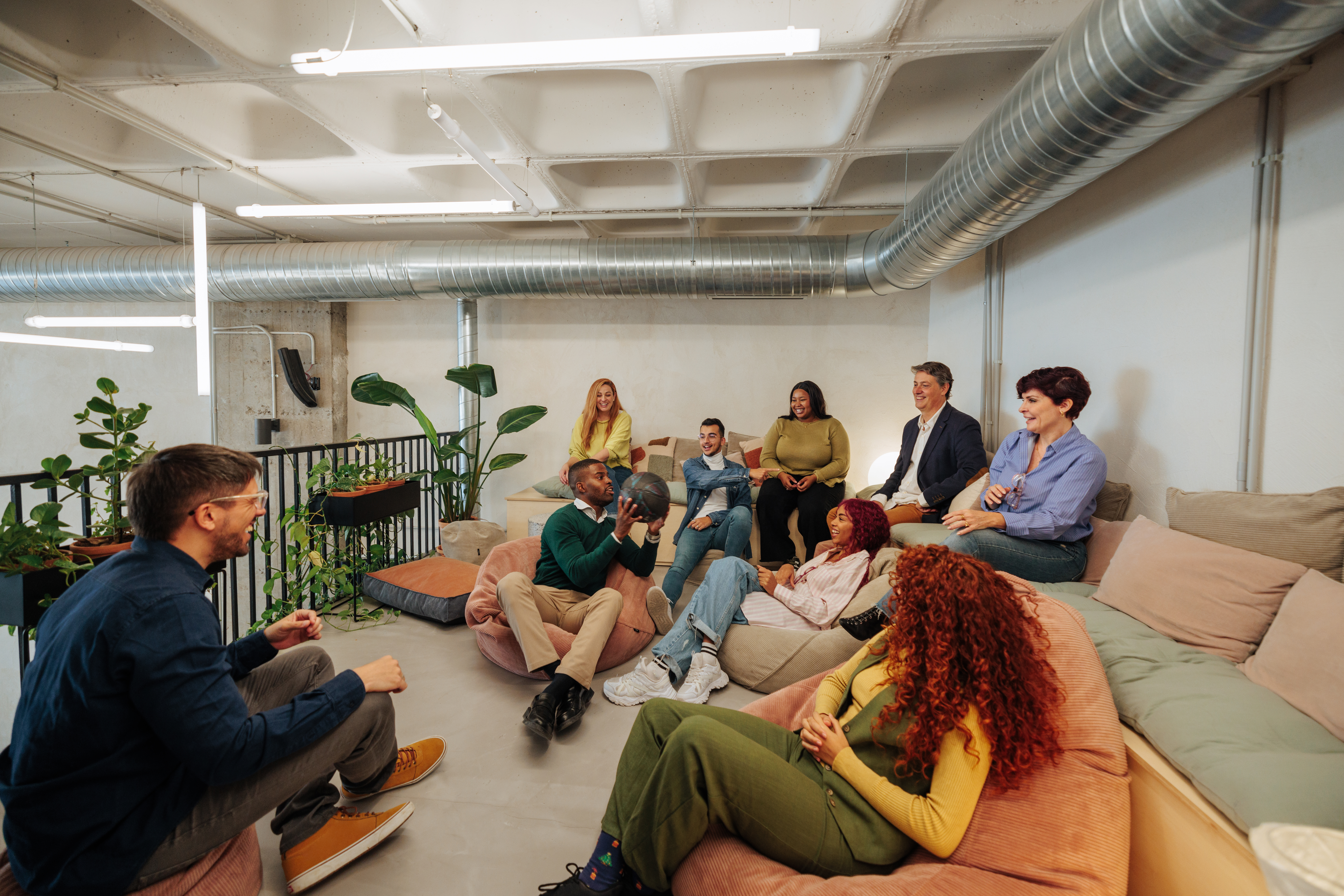 creative team relaxing and brainstorming on beanba fc750d97b0fc30fe6701