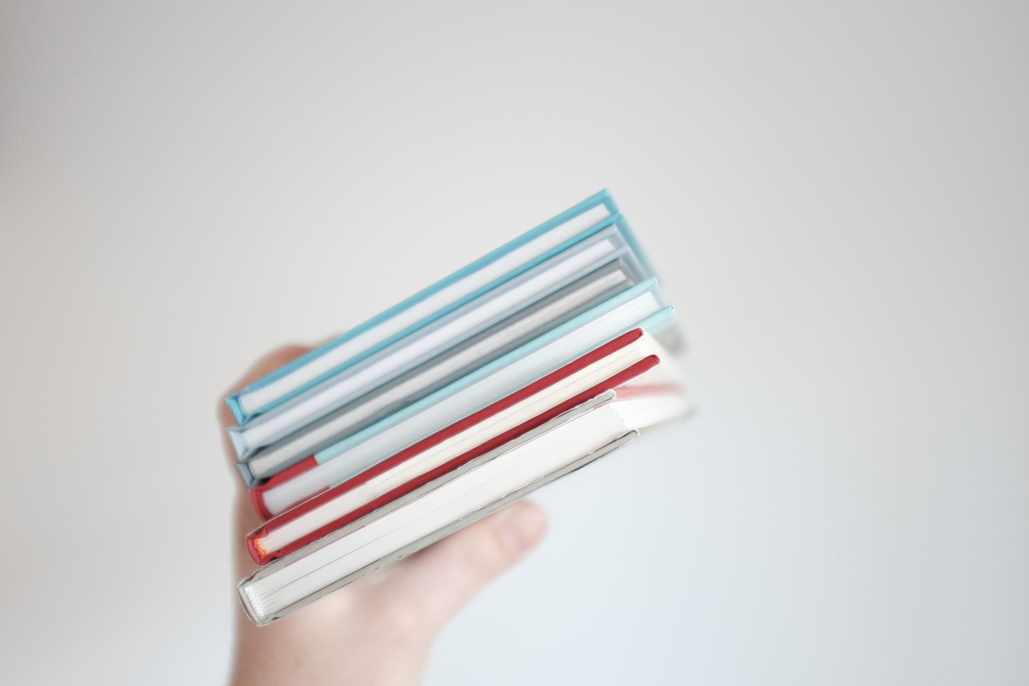 Expert Tips for Selecting Custom Plastic Materials for Trade and DIY Projects 1 cropped hand of man holding books against gray bac 5d7d4b9b39d3255b7b4e